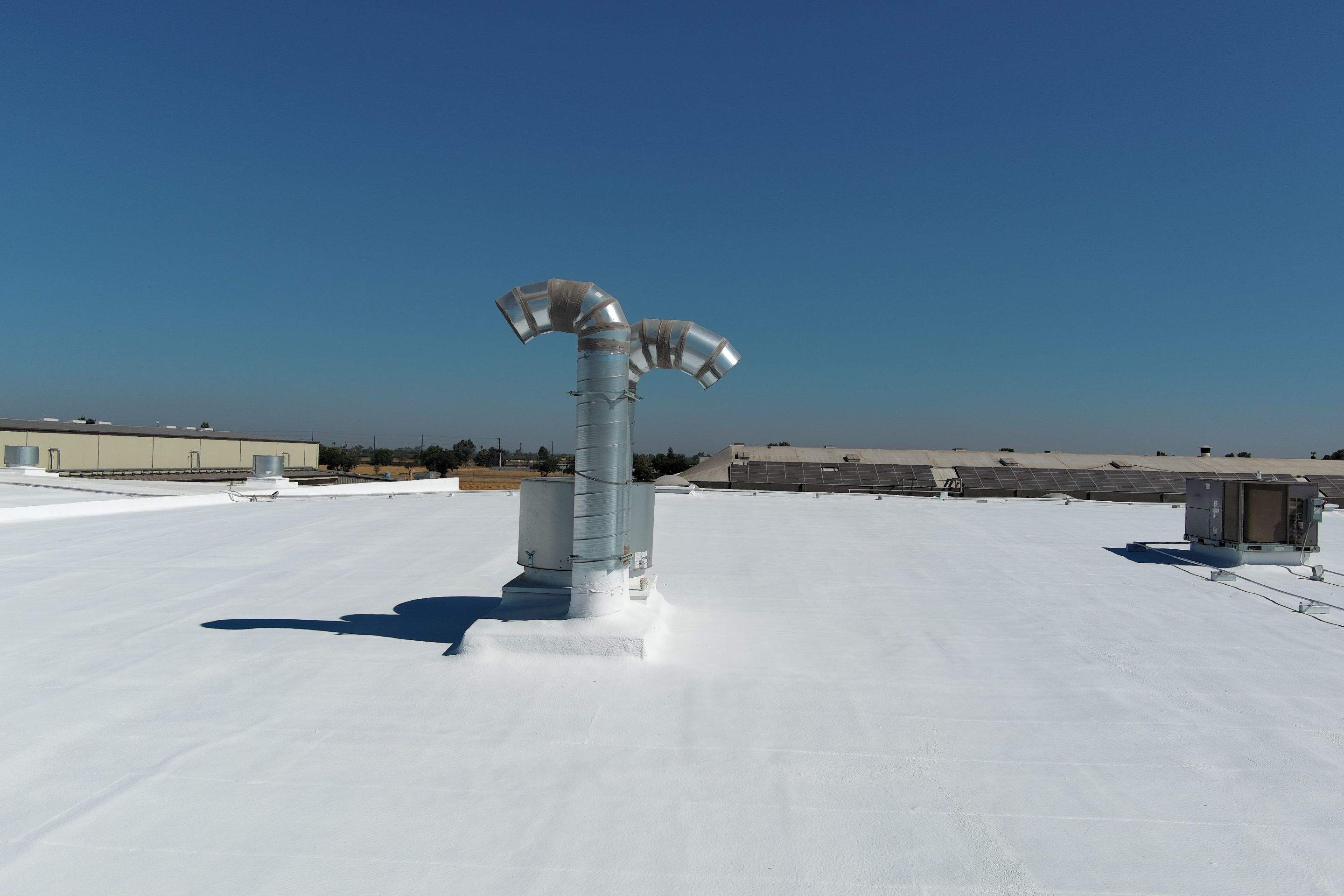 Pro Farms Spray foam roofing project by Straight Edge Roofing Inc