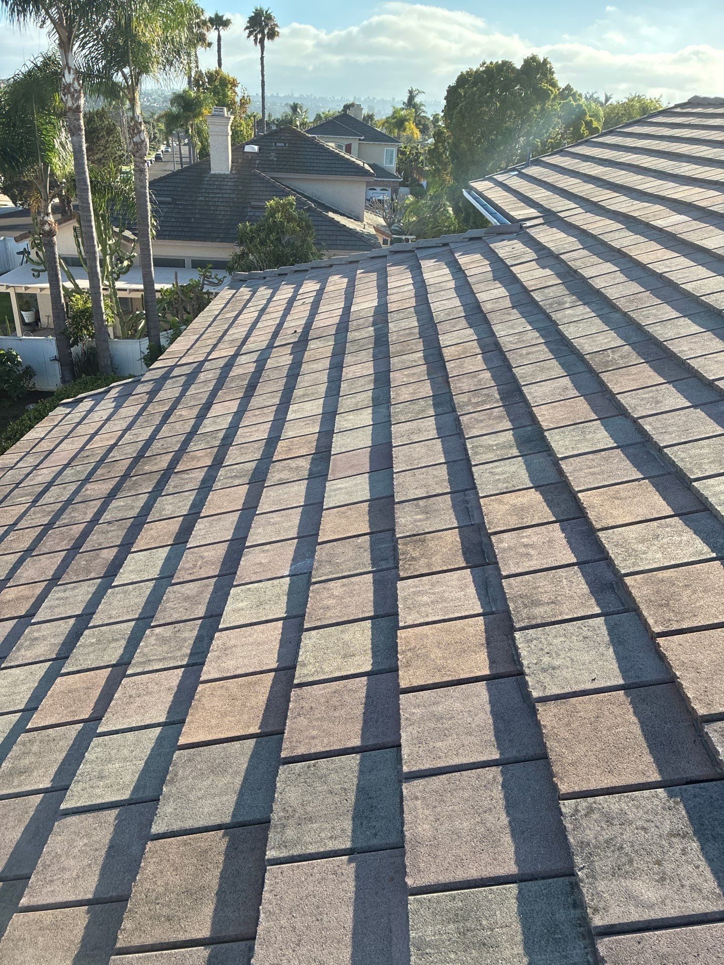 Carlsbad Concrete Tile Roof Replacement with Copper Flashing and Skylights by Reliable Roofing San Diego Inc.