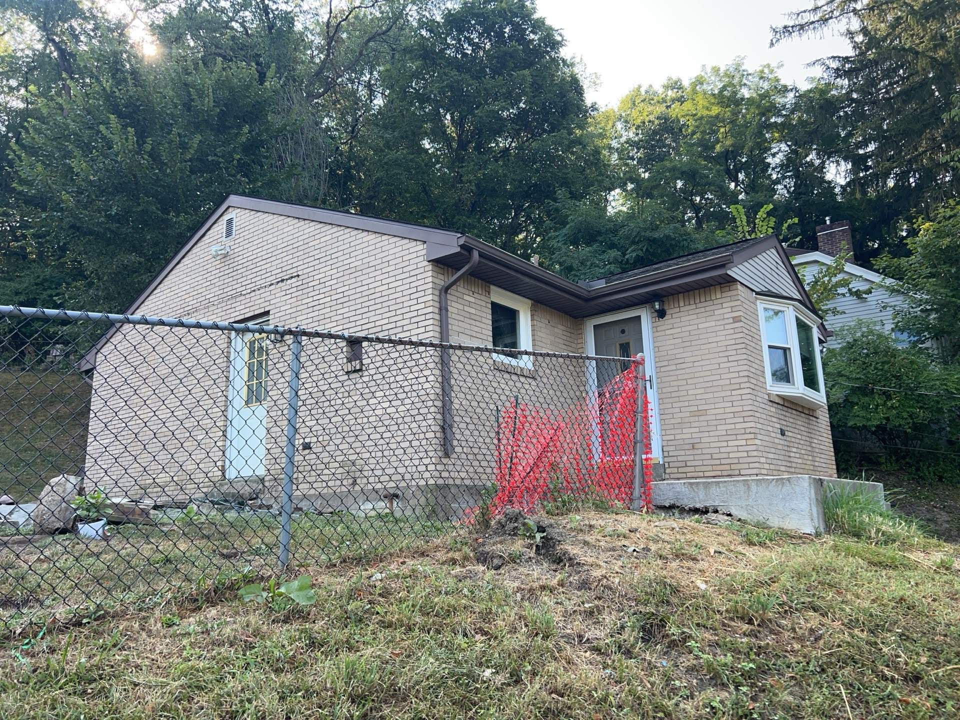 White Brick Exterior Painting and Dark Trim Transformation in Pittsburgh by Ideal Siding Pittsburgh