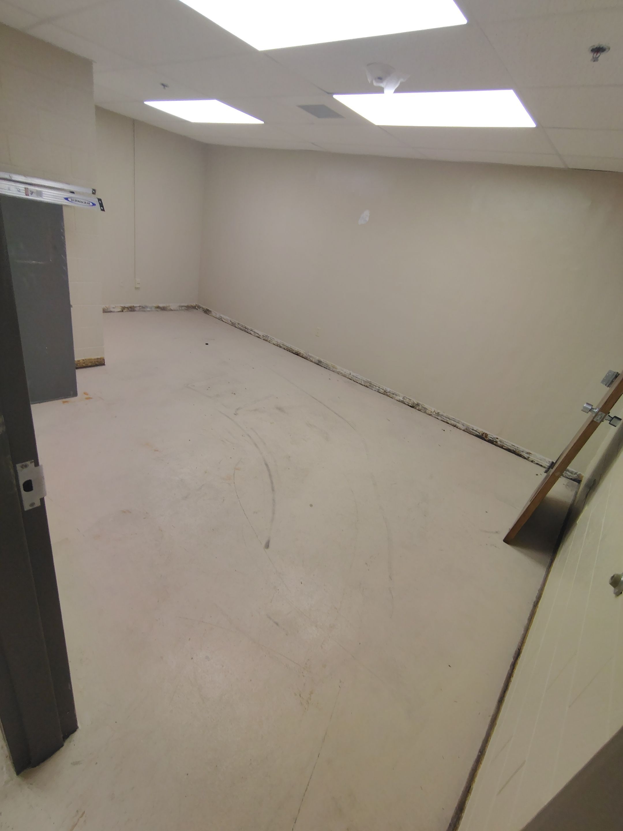 Industrial Flake Epoxy Floor Installation at Pierre National Guard Facility by Select Painting, Coatings & Garage Cabinets