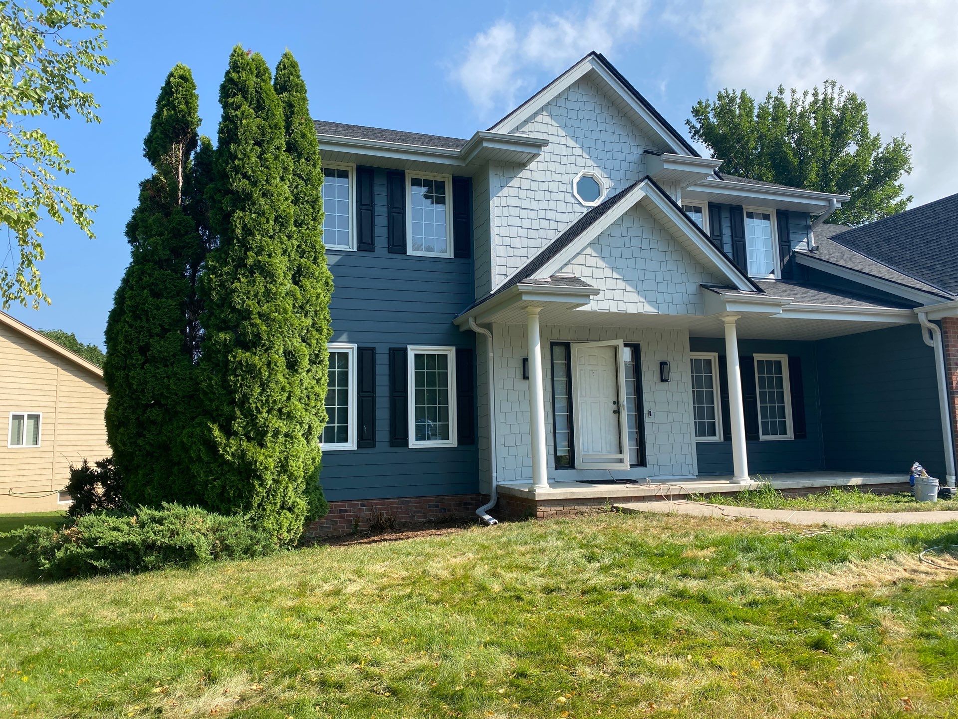 James Hardie Siding Transformation in Omaha with Evening Blue by Carps Complete Exteriors 