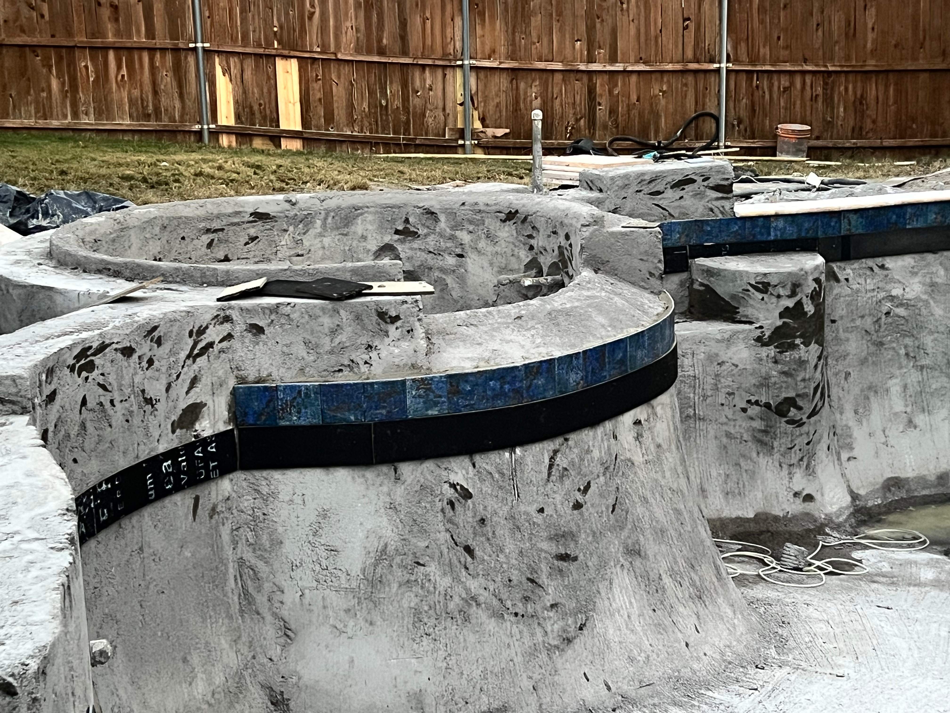 Freeform Pool with Raised Stone Spa by Pinnacle Pools and Spas - DFW