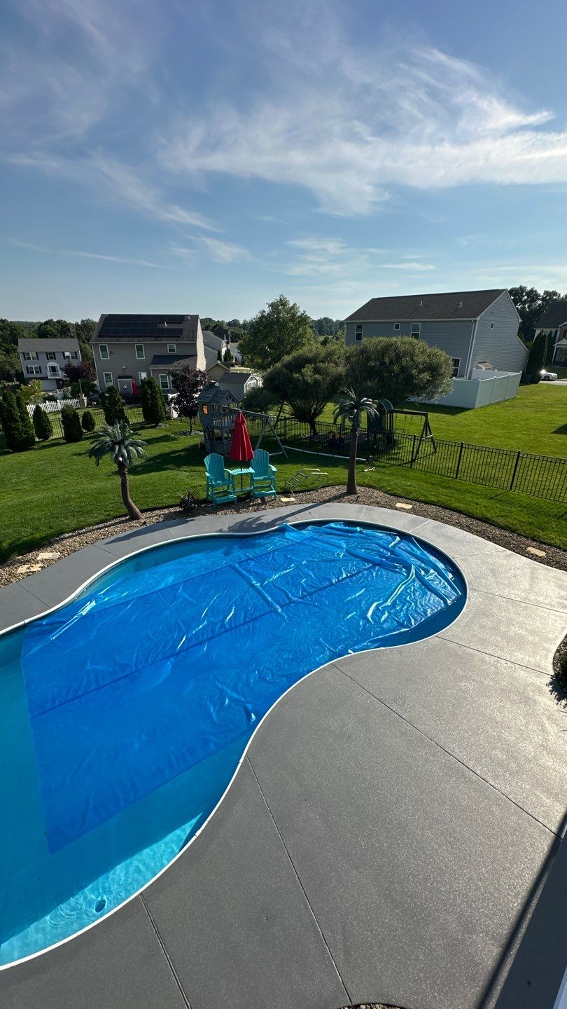 Twilight Pool Deck / Patio Project in Beaver falls by Floors in a Day, Inc