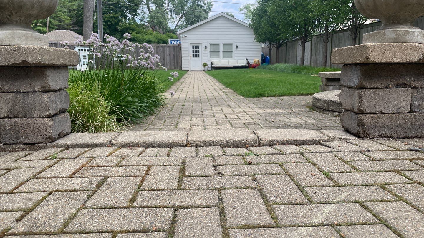 Brick patio repair, clean sand and seal by Northern Power Washing LLC.