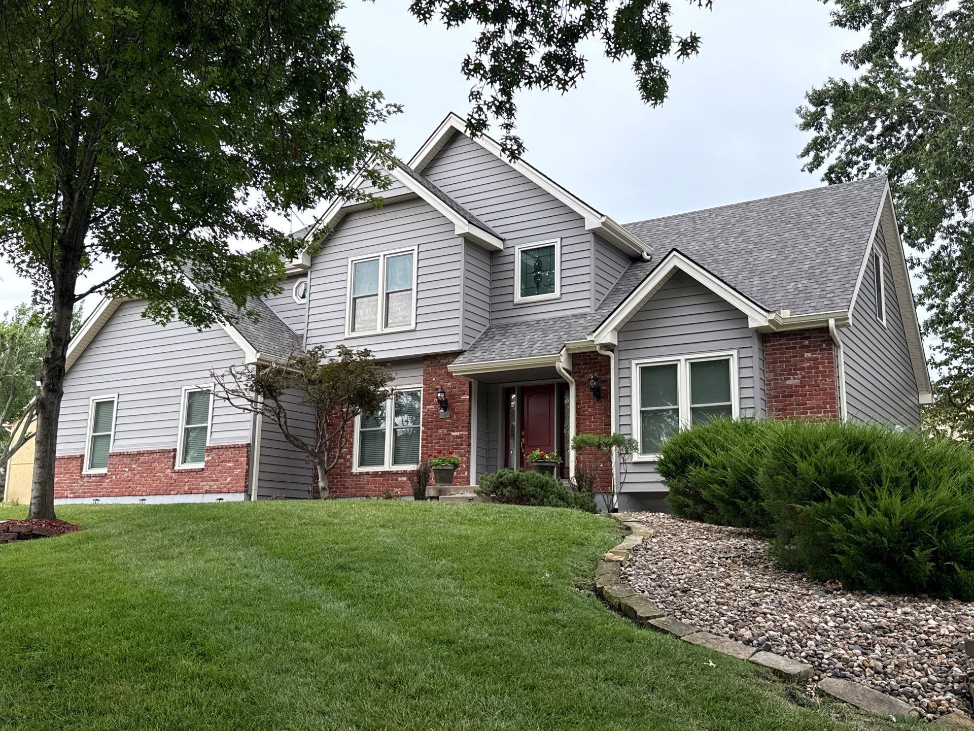 Whole Home Siding Replacement and Gutter Installation in Gladstone by EEC  Windows, Siding & Roofing 