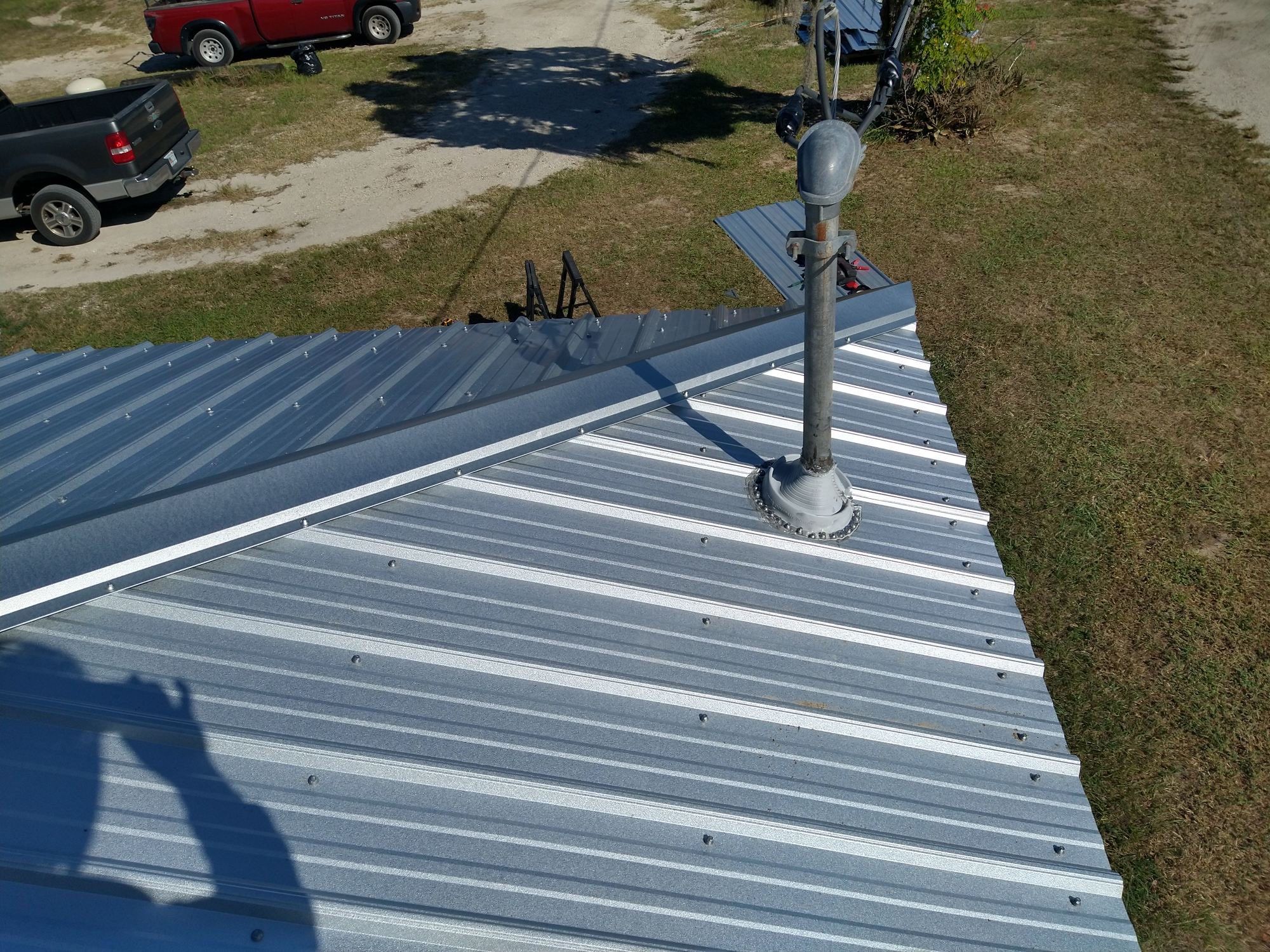 Residential Roofing Installation using 26 GA Rib Panel Galvalume by 1st Class Roofing, Inc.