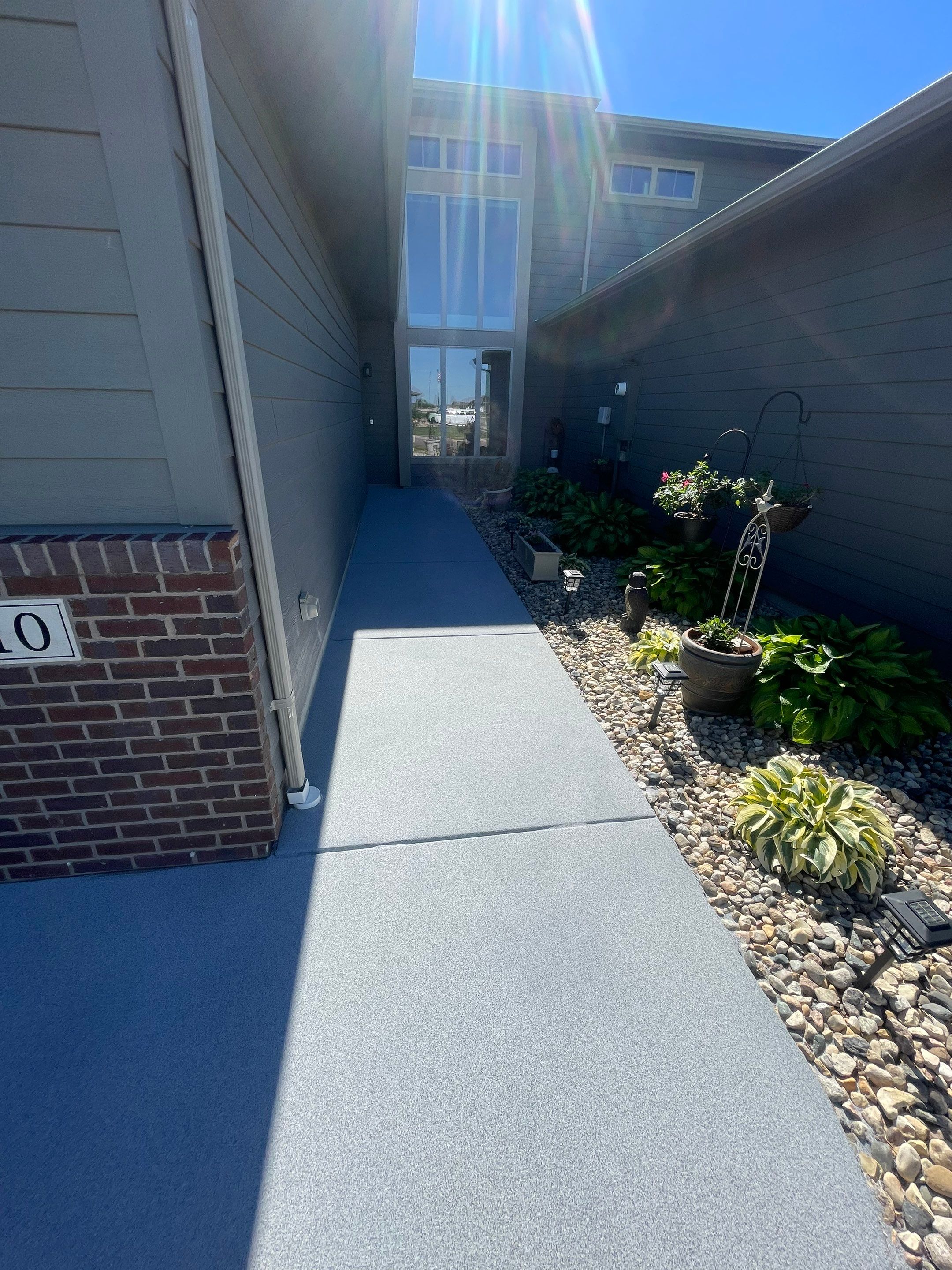 Custom Concrete Coating for Sioux Falls Patio and Front Walkway by Select Painting, Coatings & Garage Cabinets