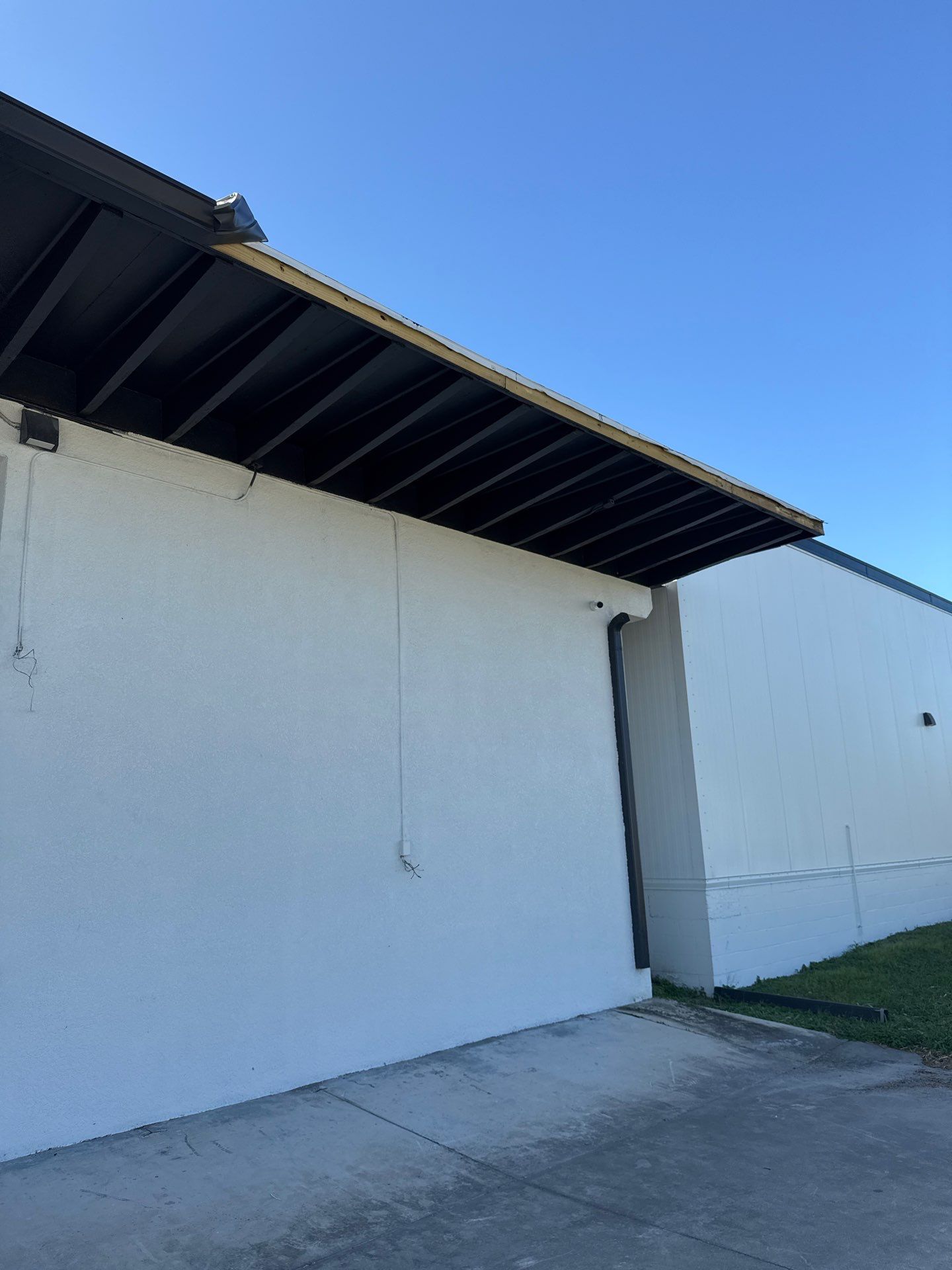 Black Seamless Gutters for Modern Homes in Sarasota FL by Gutter Professors