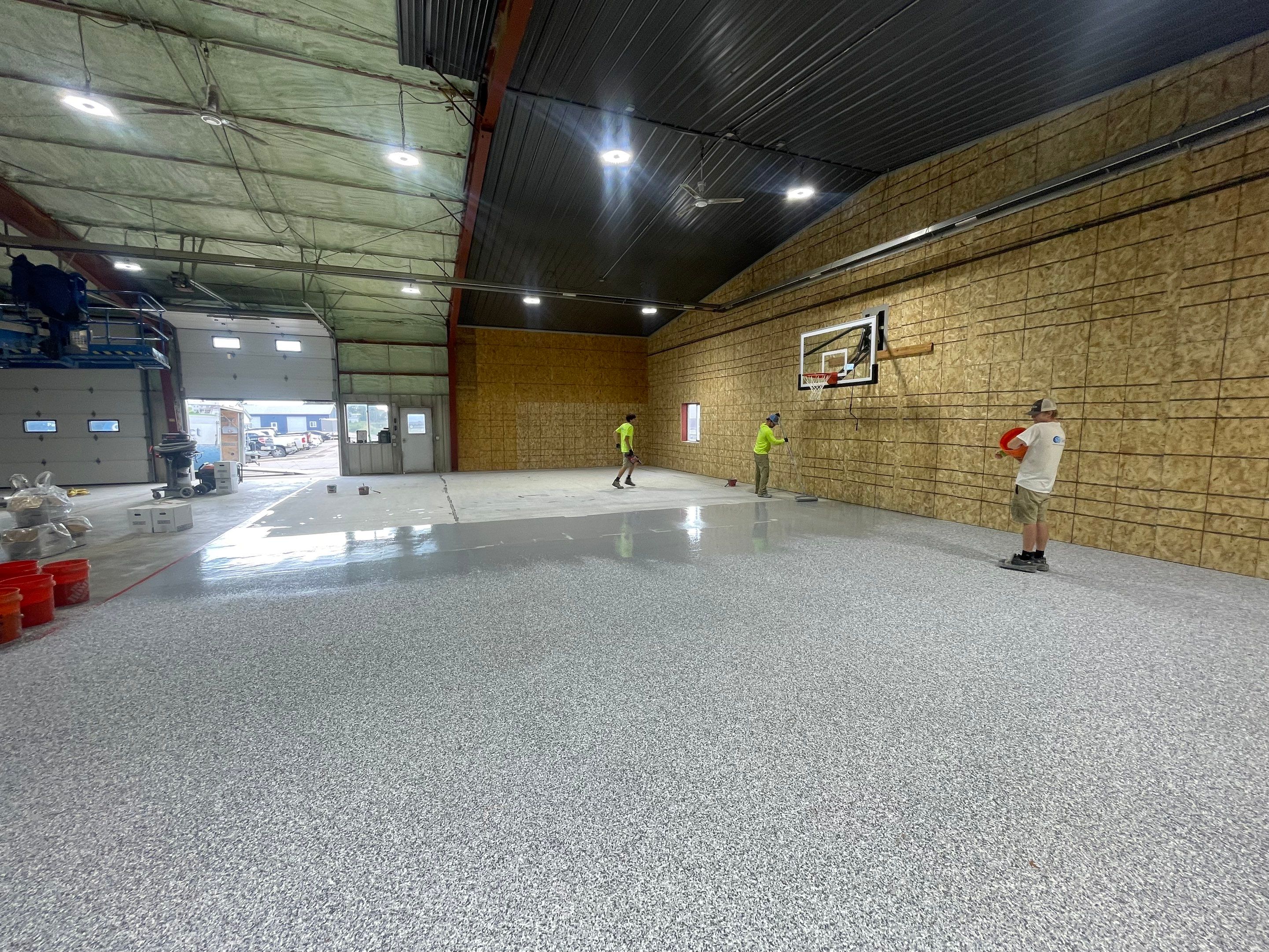 Custom Polyurea Shop Floor with Basketball Court Lines in Rock Valley by Select Painting, Coatings & Garage Cabinets