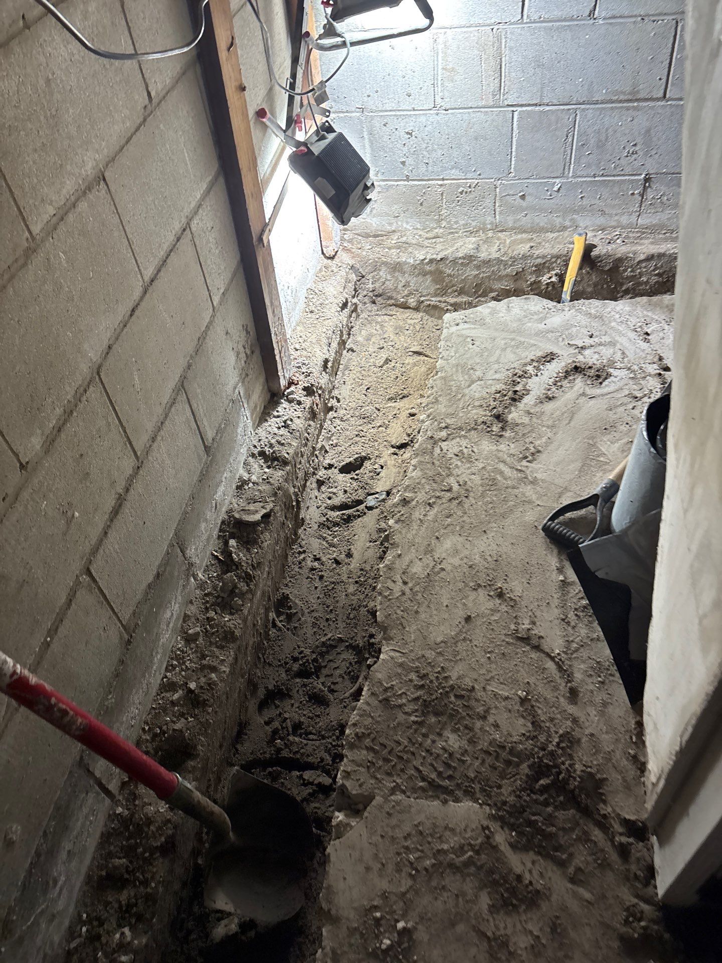 Interior Drain Tile & Buried Discharge in South Minneapolis by Waterproofing Northeast