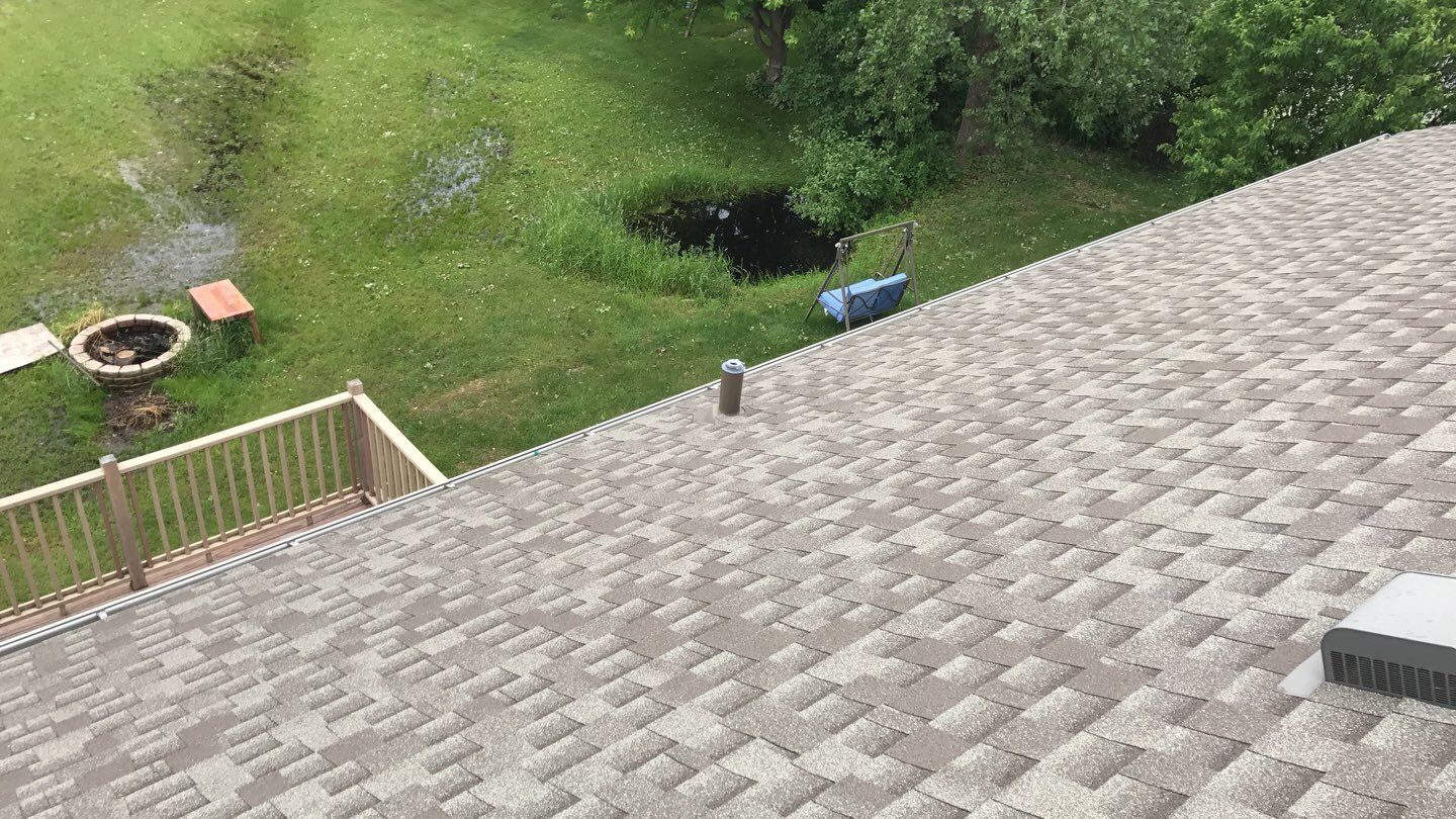 Storm Damage Restoration using Atlas Pinnacle Shingles and Mastic Vinyl Siding  by MODERN EXTERIOR SYSTEMS