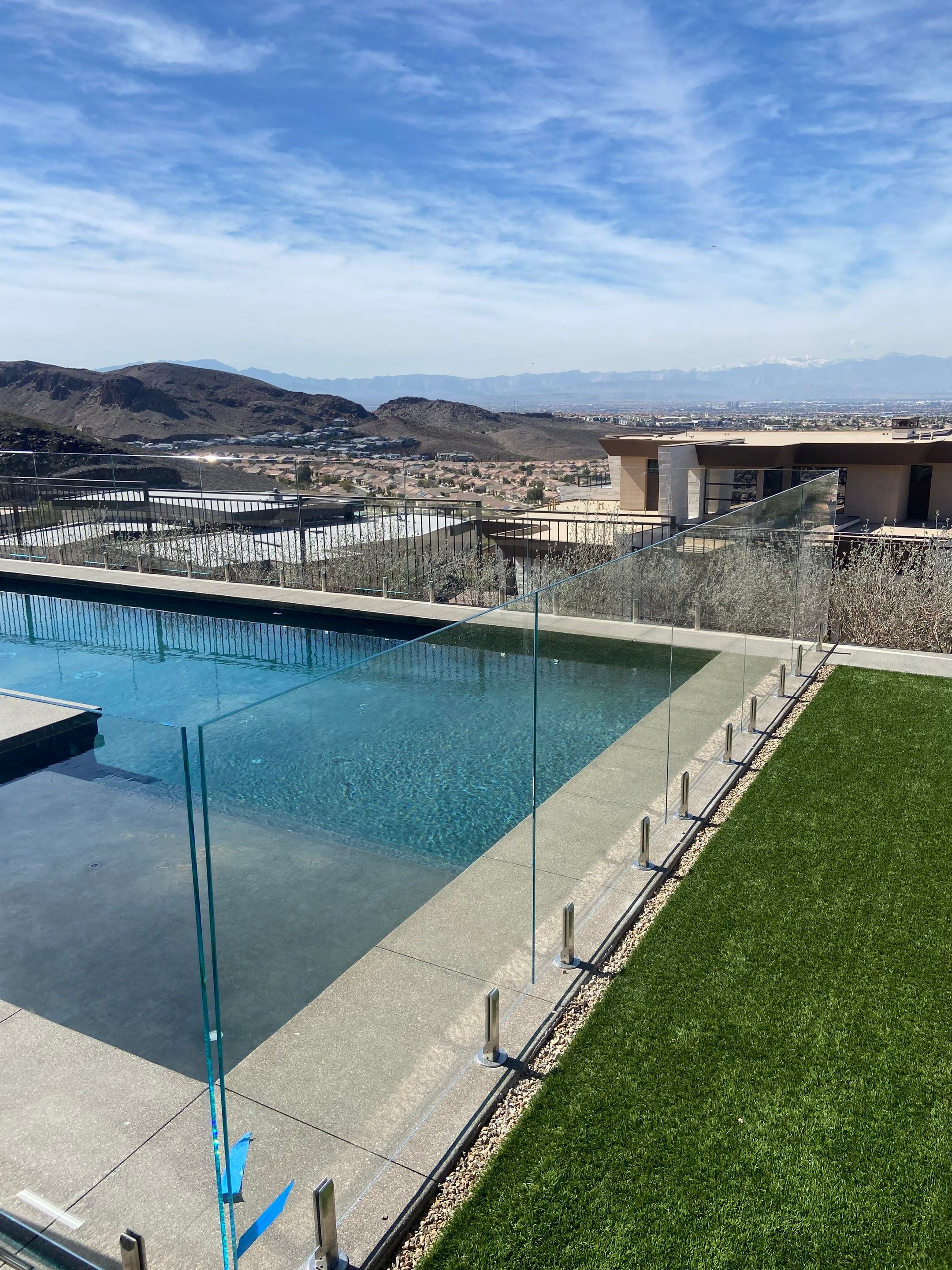 Exterior wood refinish & glass pool enclosure by Level Builders
