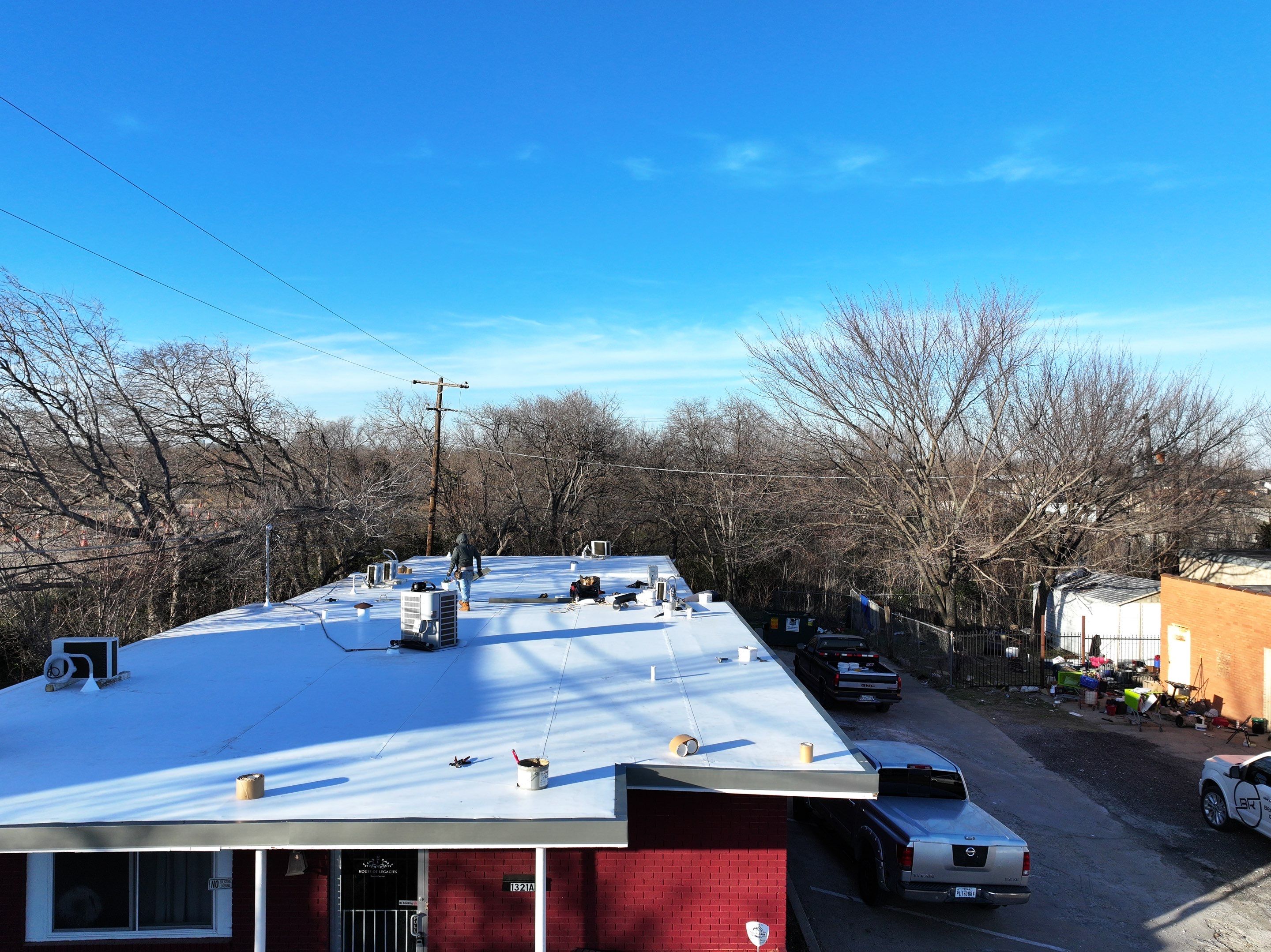 Commercial roofing overlay using GAF TPO over an old ballast roof by Becker Roofing and Exteriors