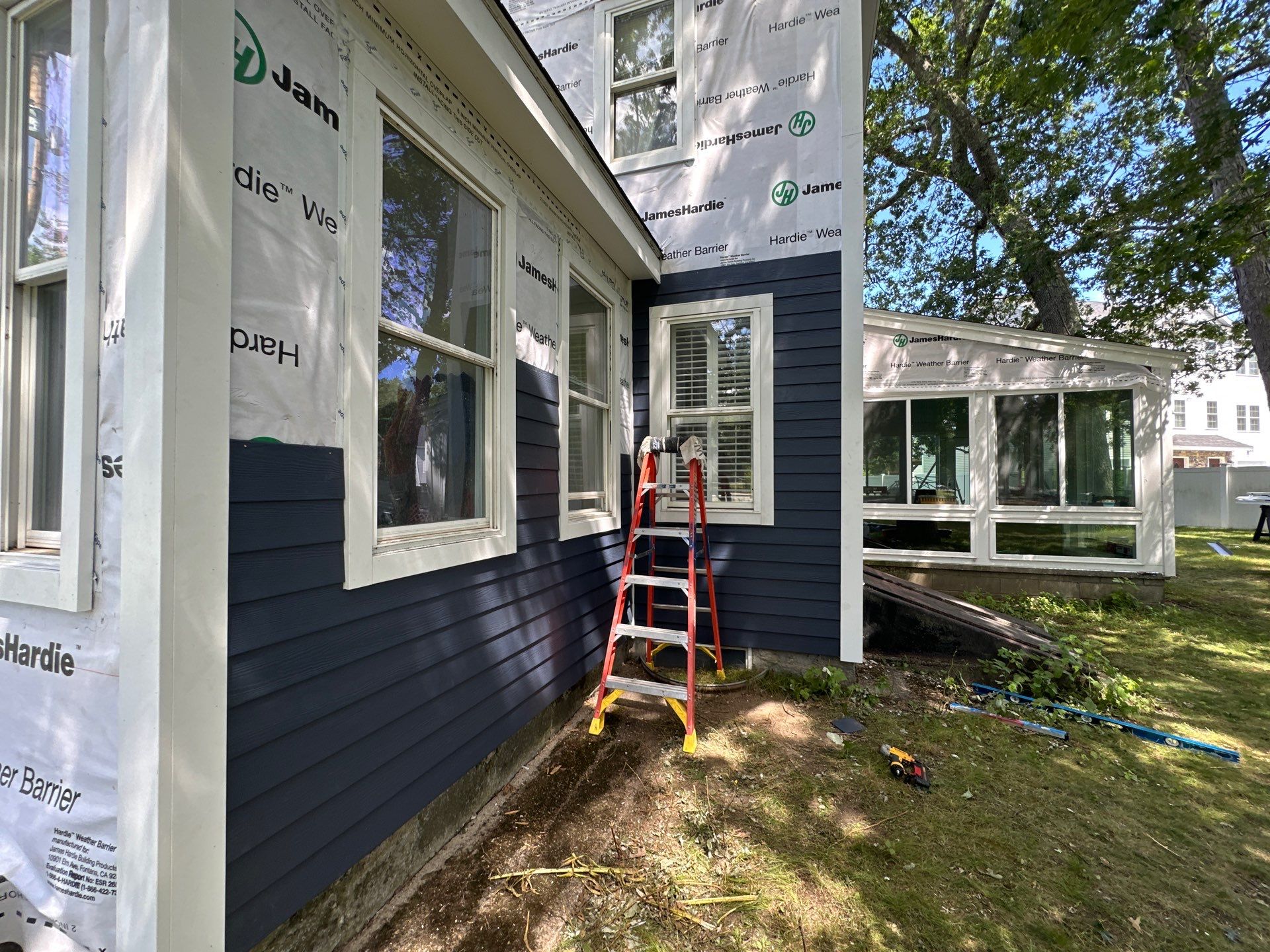 James Hardie Lap Siding Installation in Chelmsford, MA by Mighty Dog Roofing of Greater Middlesex County