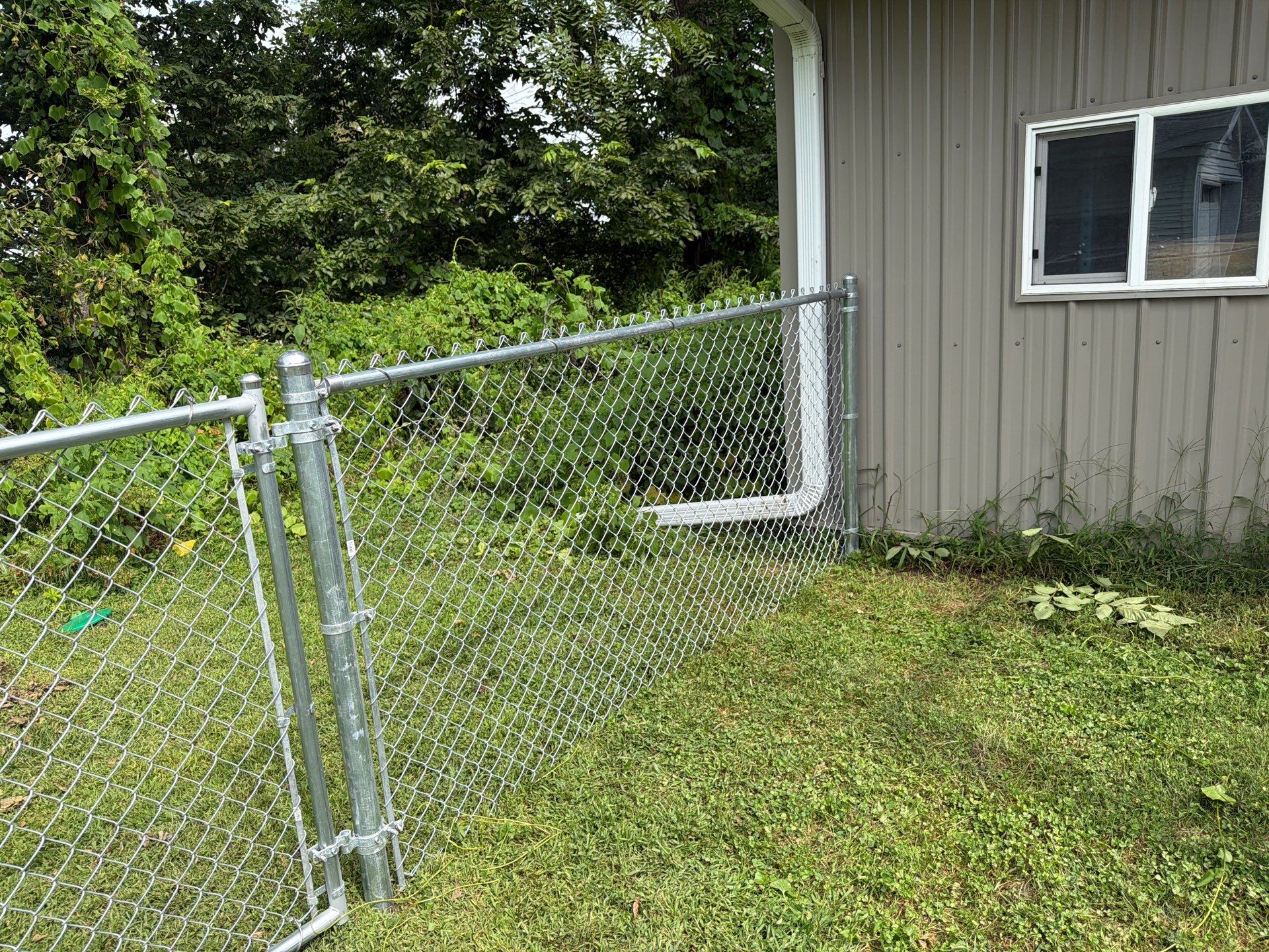 Galvanized Chain Link Fence and Gate Installation in La Porte City by Perfect Picket Fence and Stain