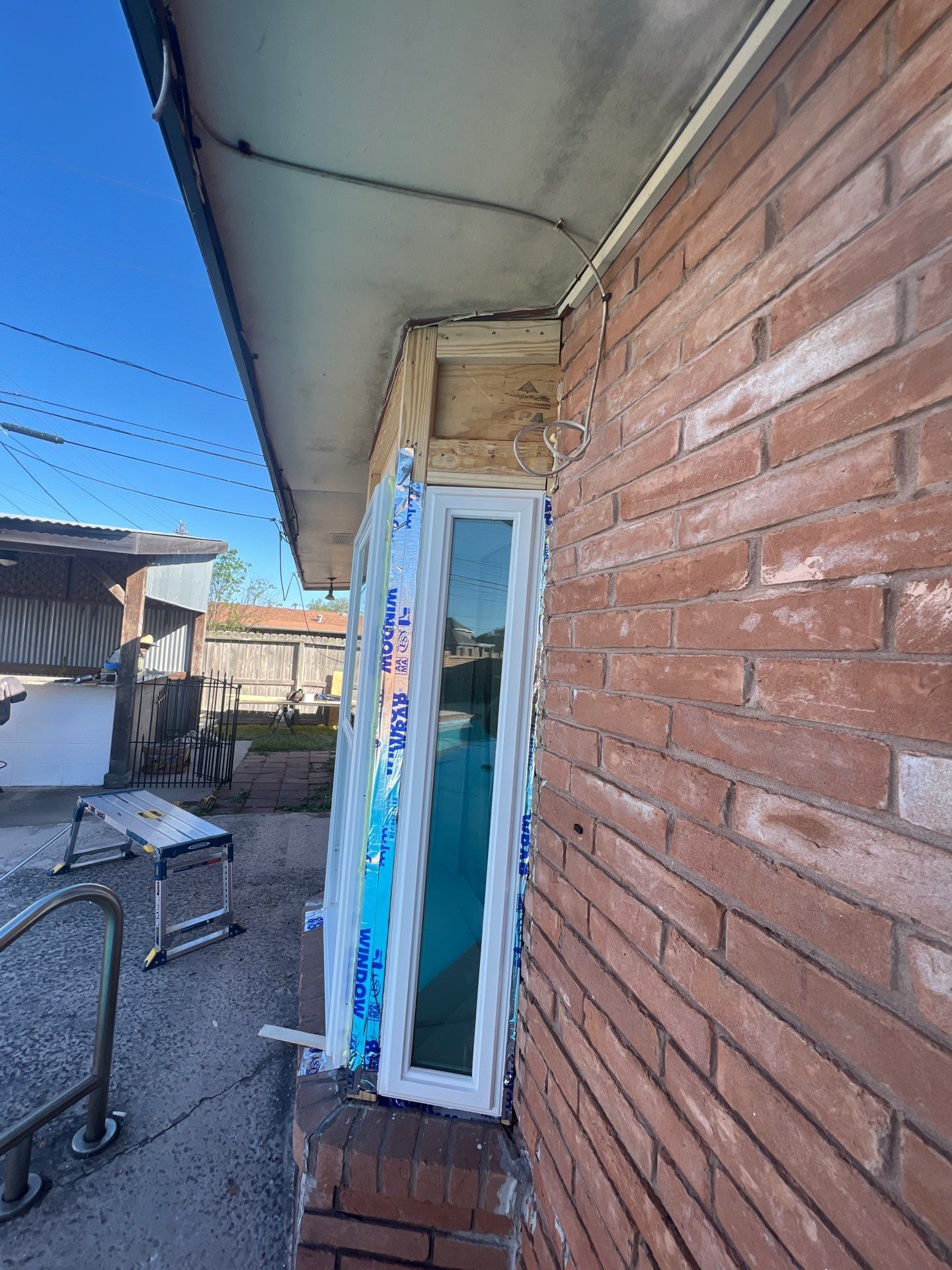 Windows in Brick with a Bay Window by Bayfront Roofing and Construction