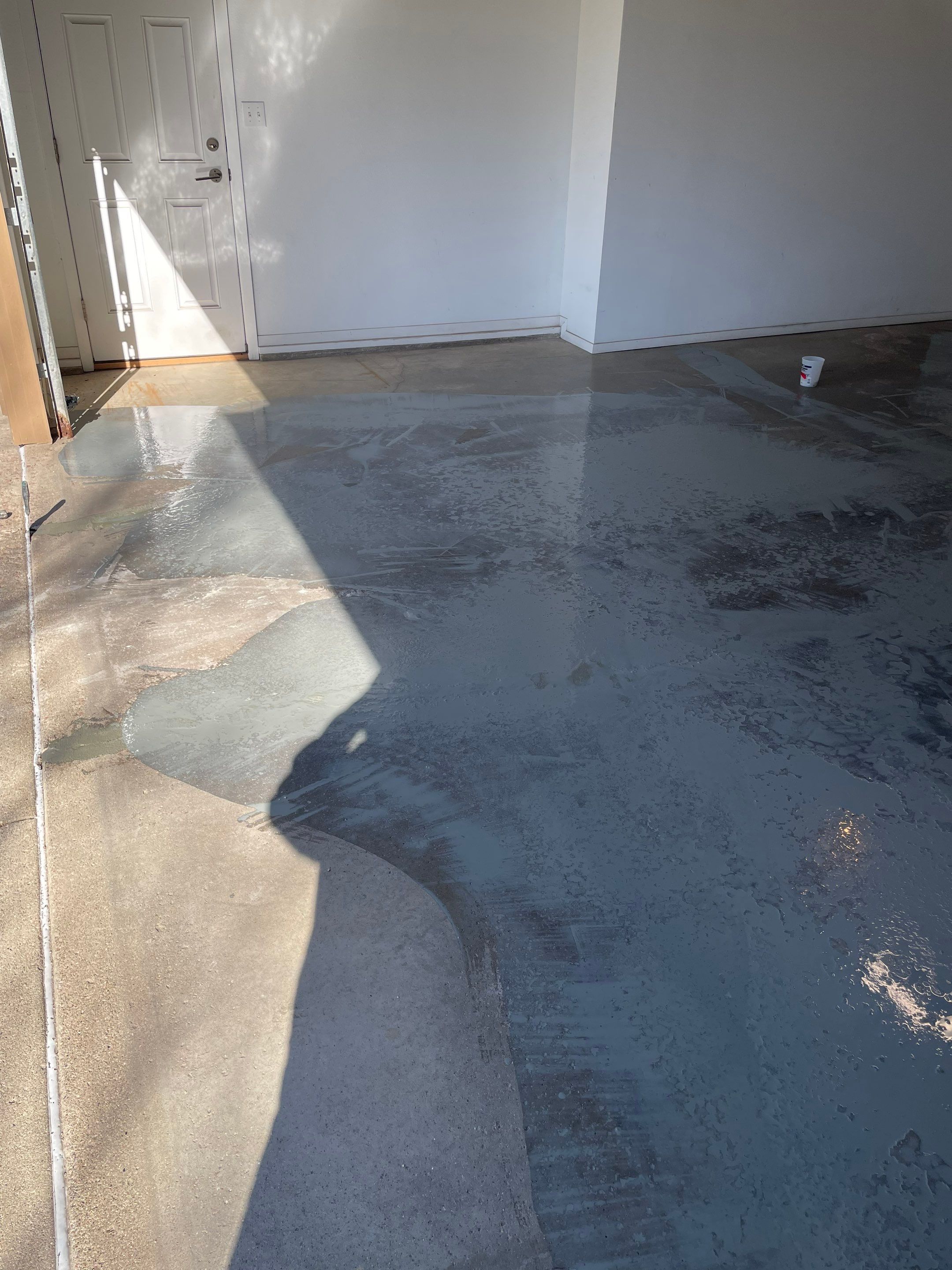 Yankton Garage Floor Restoration with Gray Speckled Epoxy Coating by Select Painting, Coatings & Garage Cabinets
