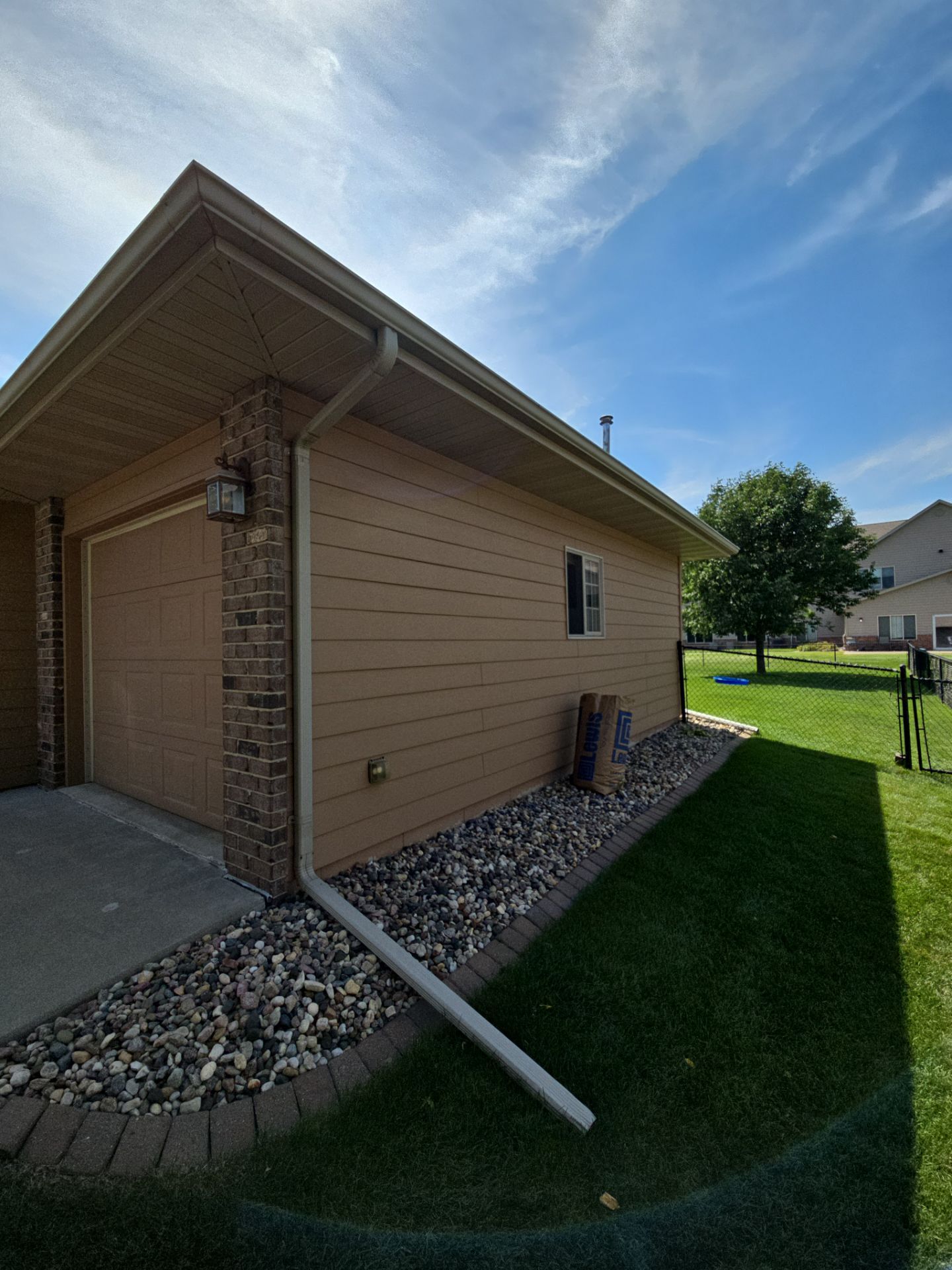 Sioux Falls Residential Exterior Door and Siding Refresh by Select Painting, Coatings & Garage Cabinets