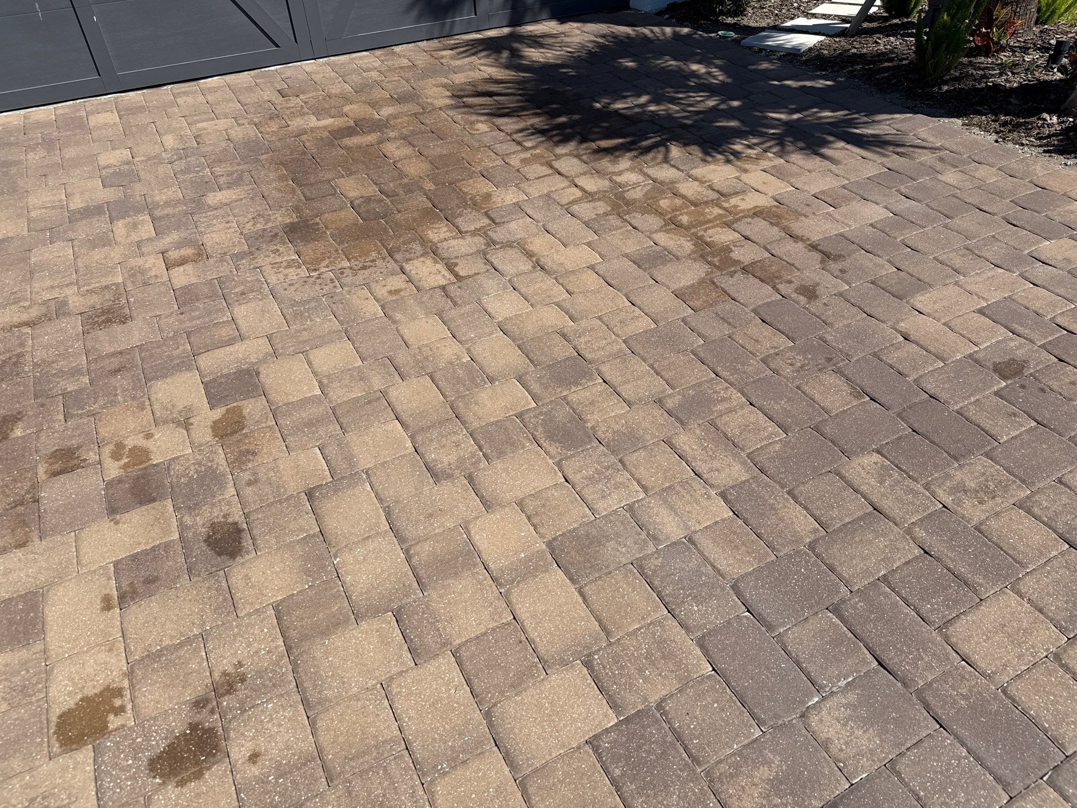 Oil Stain Removal on Paver Driveway | Esplanade at Artisan Lakes, Palmetto FL by Sunshine AquaWash