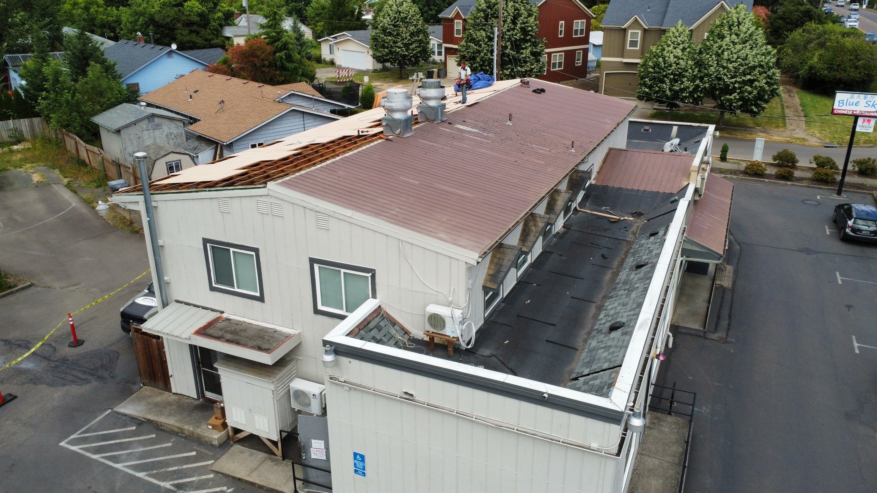 Commercial Flat Roof Installation using Bruce and Dana Snap Lock Metal (Color: Brown) by Orezona Building & Roofing Company, Inc.