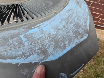 Close up of HVAC unit with blue chalk markings