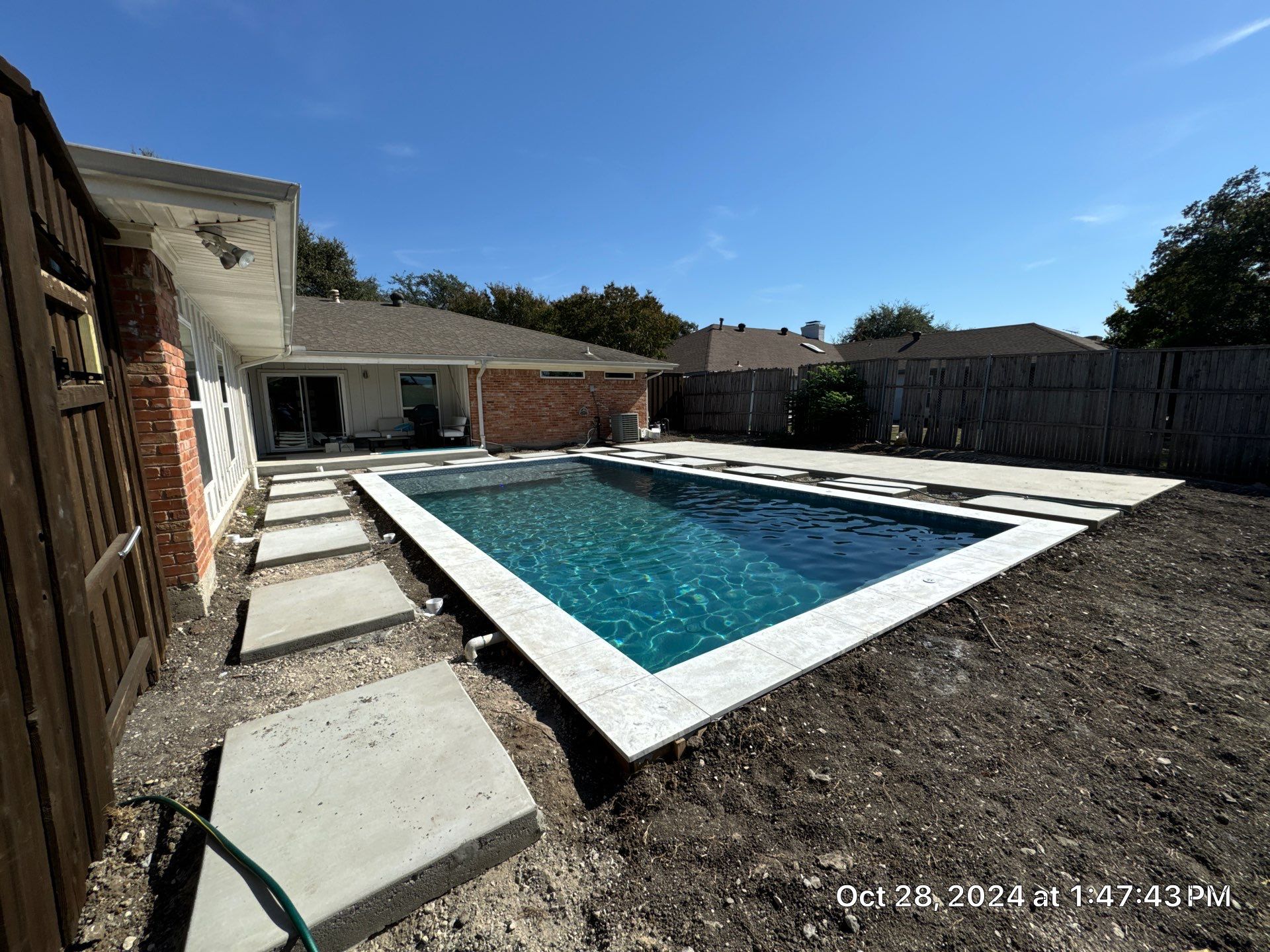 Classic Geometric Pool with Expansive Concrete Deck by Pinnacle Pools and Spas - DFW