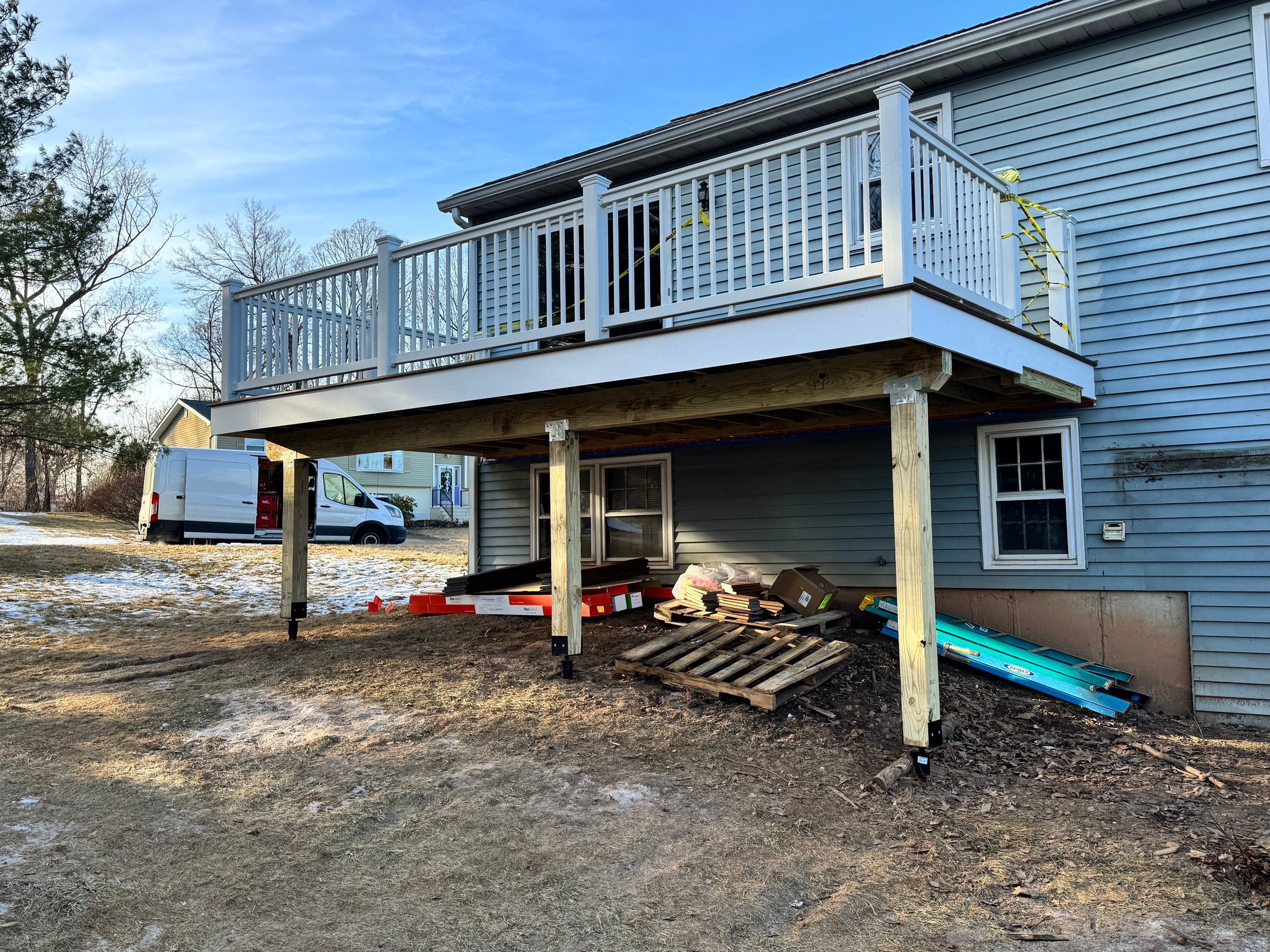 Deck replacement with Trex Select Saddle and White Select T rail. by DiGiorgi Roofing and Siding Inc