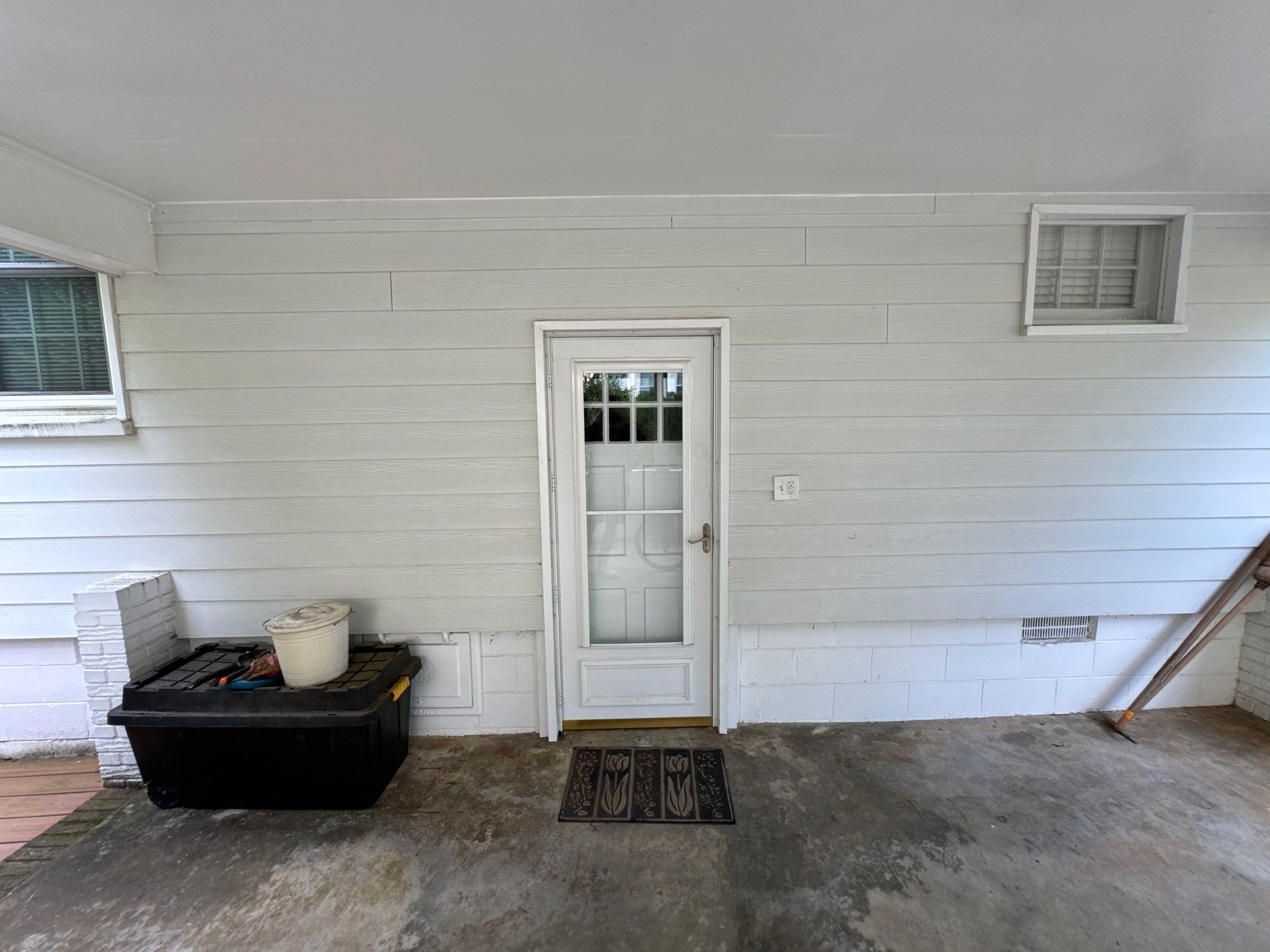 pressure washing company cleaning concrete floor and house siding in winston salem nc