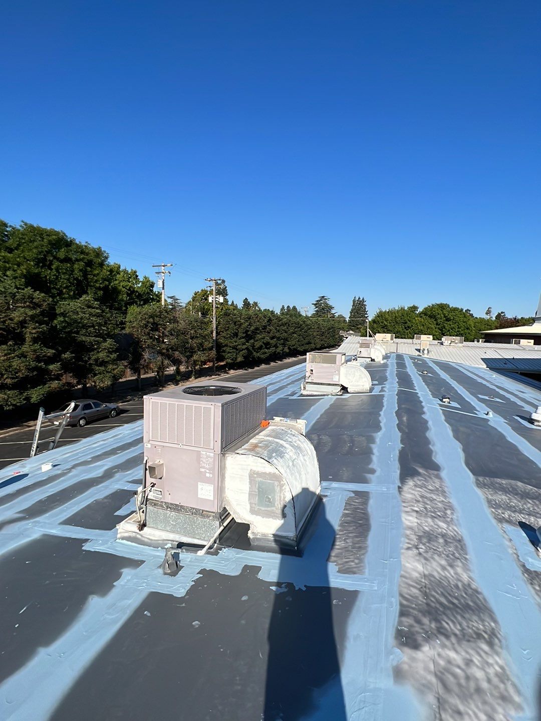 MR Roofing system using Benchmark/PUMA XL coatings over TPO single-ply roofing by Straight Edge Roofing Inc