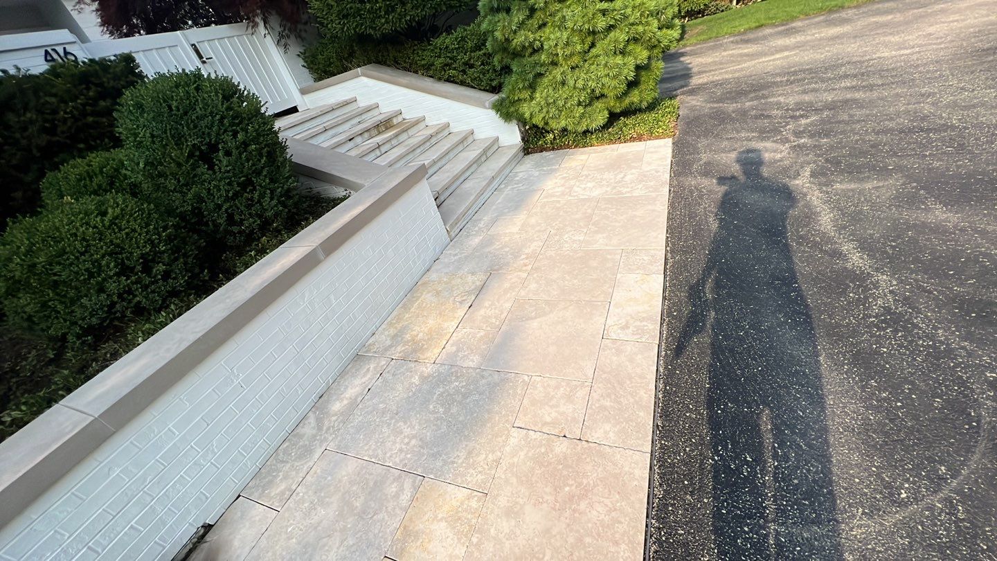 marble patio cleaning and sanding using Polysweep polymeric sand by Northern Power Washing LLC.