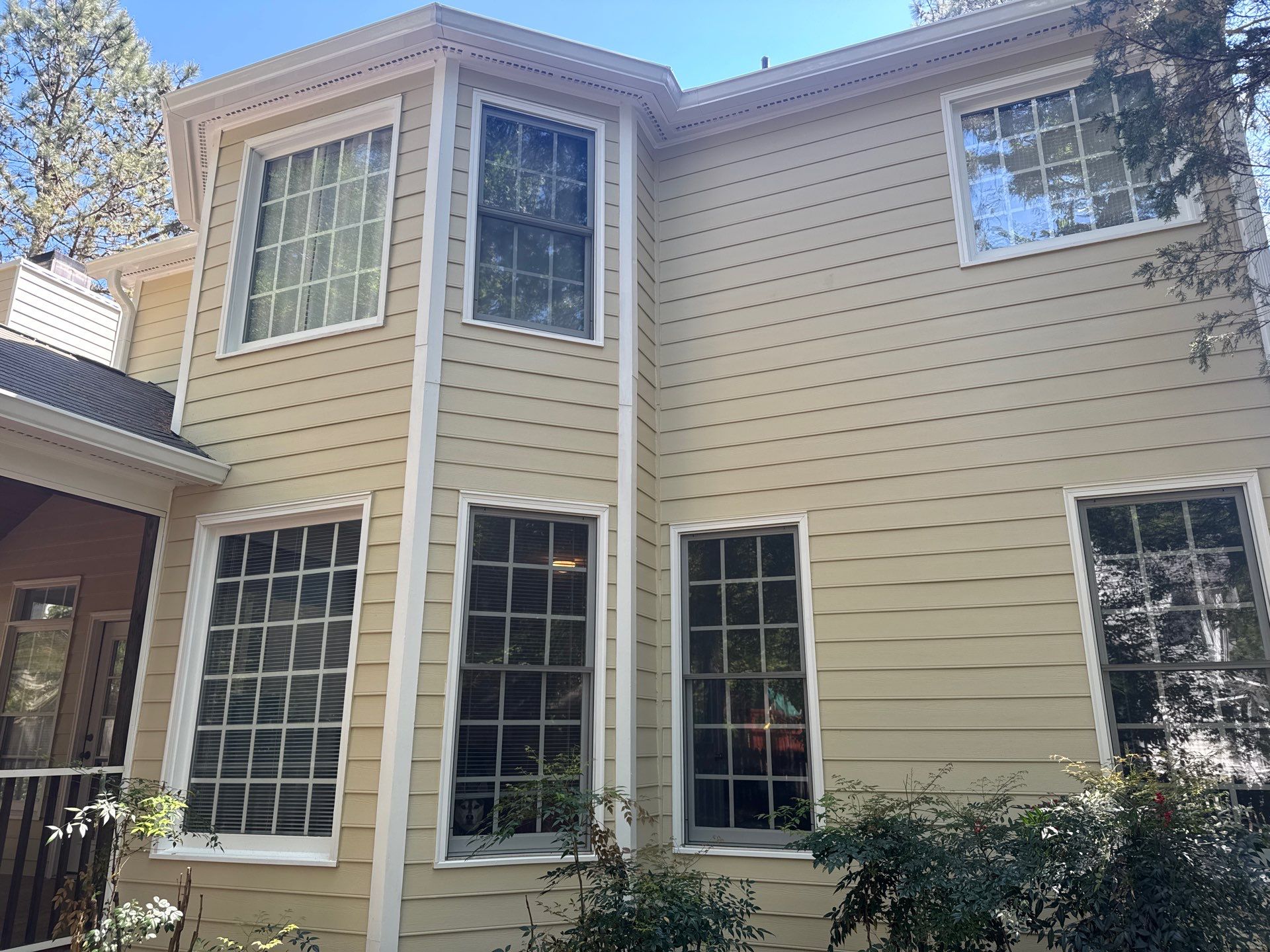 Exterior paint and siding replacement by GonzalezPainters & Contractors Inc 