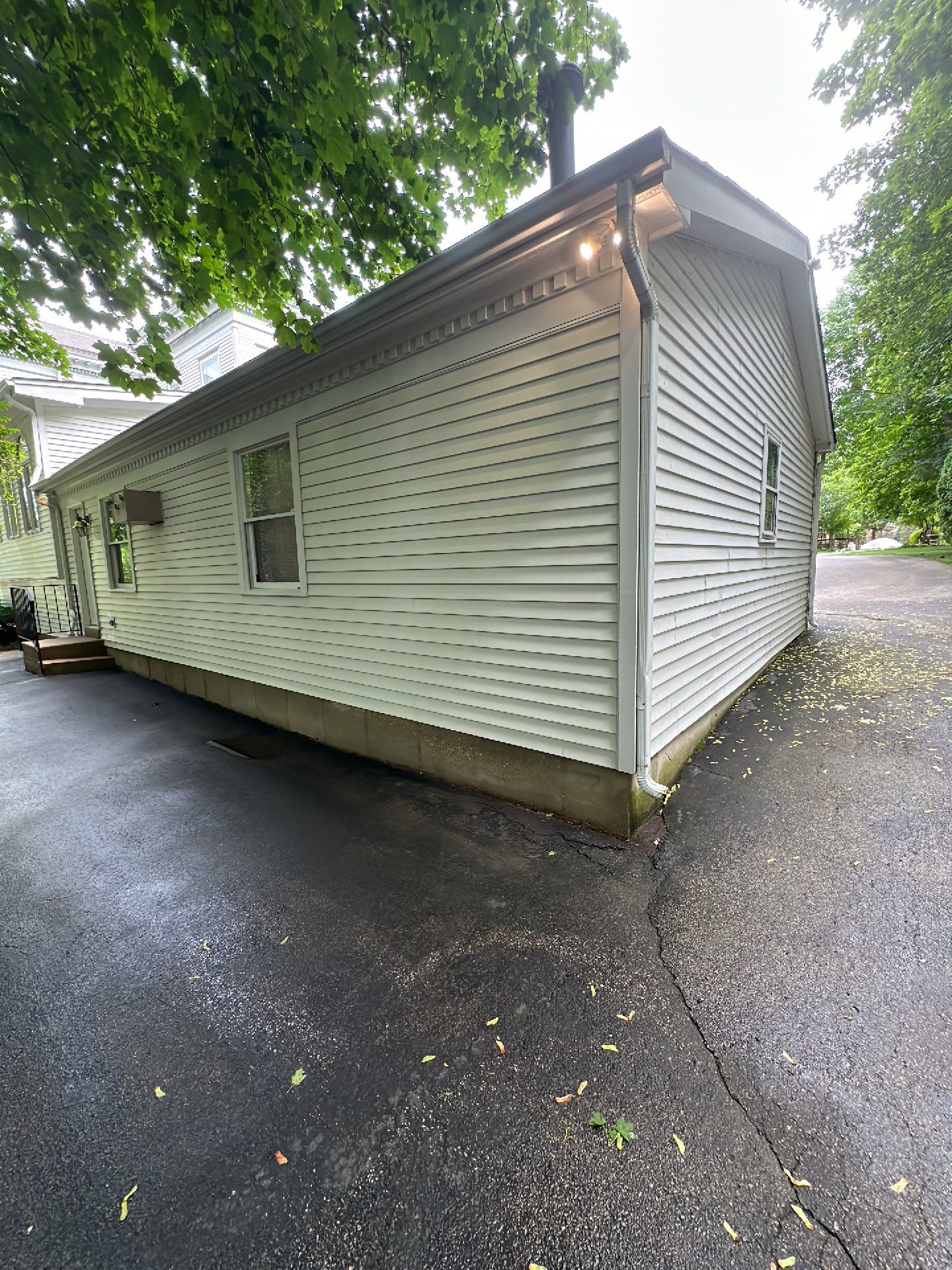 Housewashing  using Algaecide, soft wash soap by Northern Power Washing LLC.