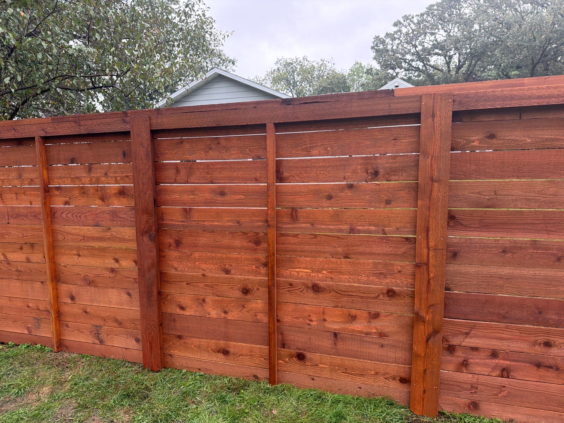 Stained Horizontal Cedar Wood Privacy Fence in Cedar Falls by Perfect Picket Fence and Stain