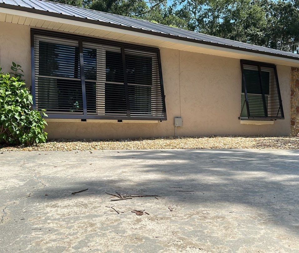 Hurricane Rated Bahama Shutters in Gray Brown by Smart Guard Shutters