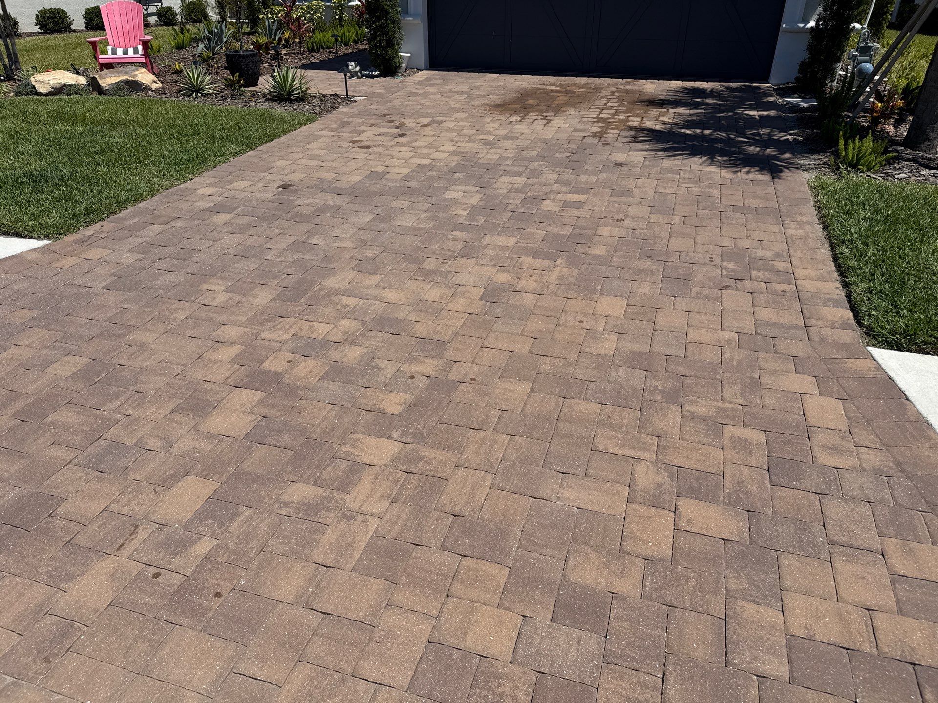 Oil Stain Removal on Paver Driveway | Esplanade at Artisan Lakes, Palmetto FL by Sunshine AquaWash