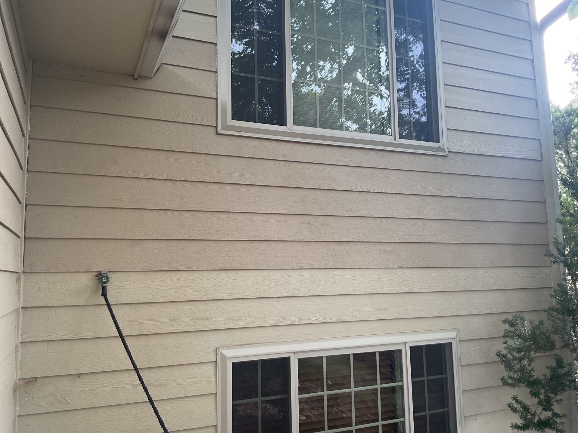 Sioux Falls Exterior Siding Replacement and Custom Deck Upgrade by Select Painting, Coatings & Garage Cabinets
