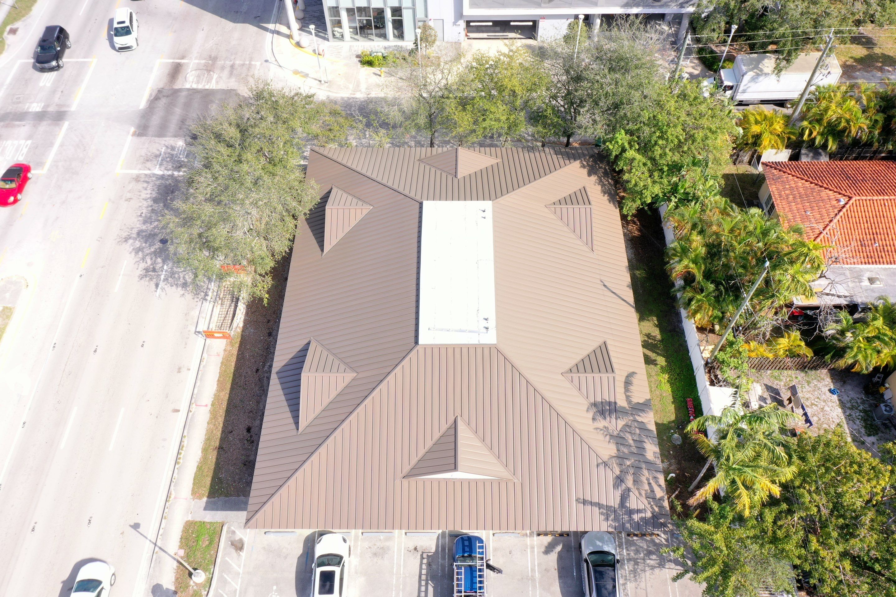 COMMERCIAL REROOF 24 GUAGE MEDIUM BRONZE 1-1/2" MECHANICAL SEAM "ZEBRA METHOD" by Earl W. Johnston Roofing 