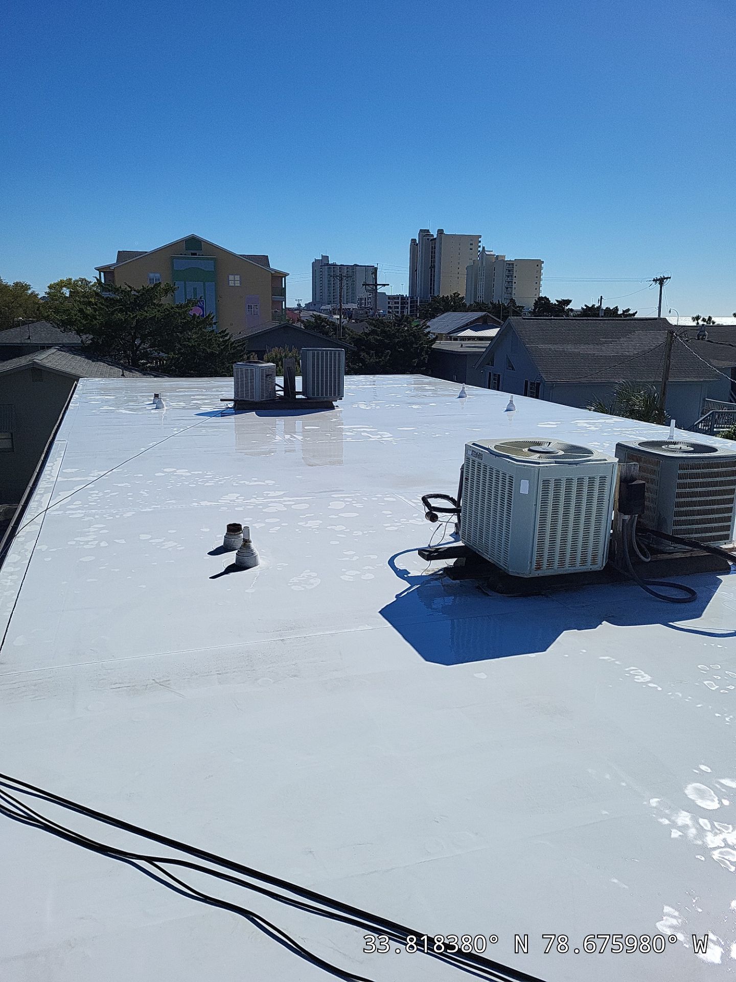 Commercial Building Roof Coating using 924 Eterna-Sil Premium Silicone Roof Coating by RGR Construction and Roofing, LLC