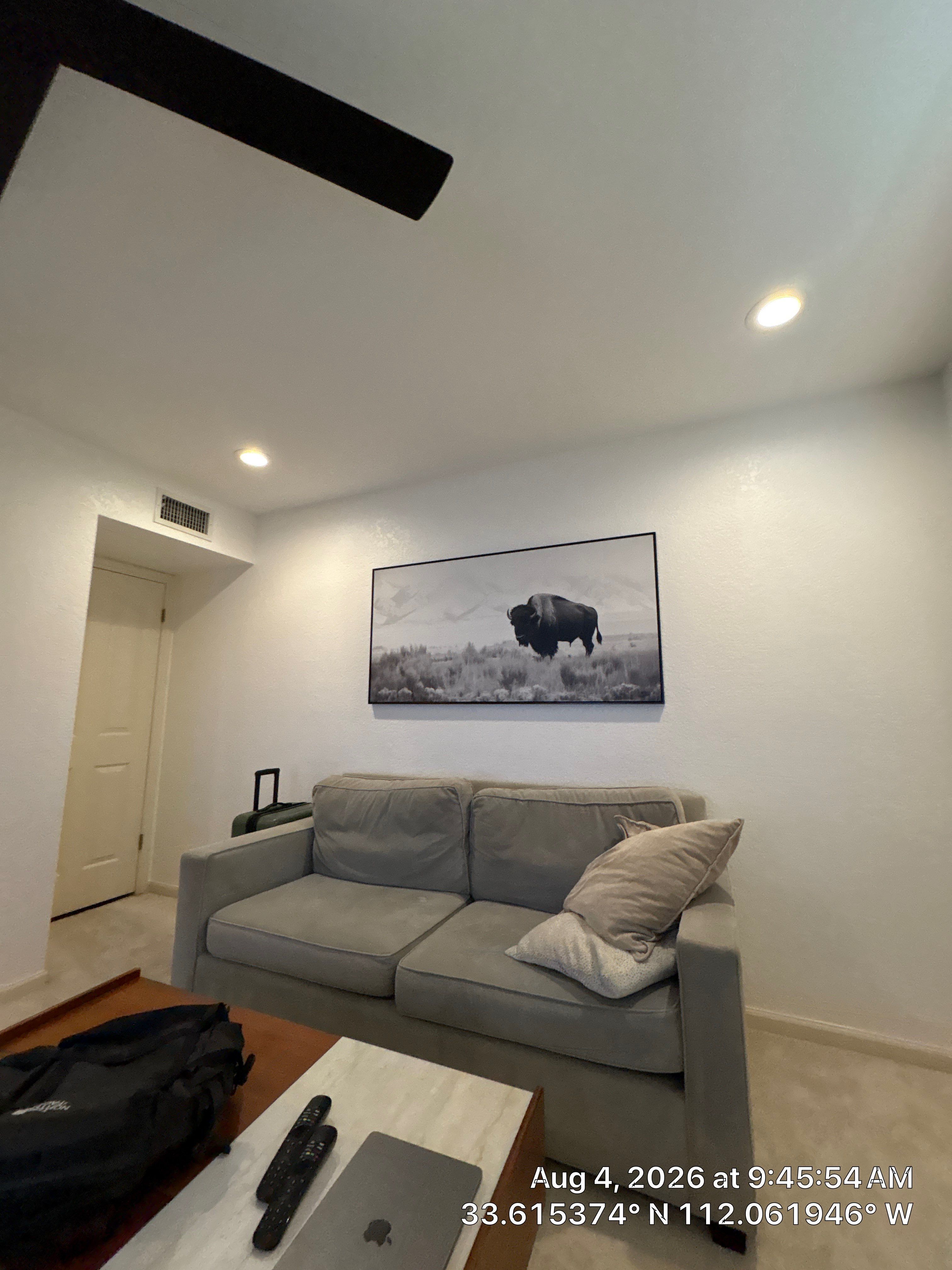 Custom Home Office Setup Featuring Arched Plantation Shutters and Accent Wall by CompanyCam Sales Demo
