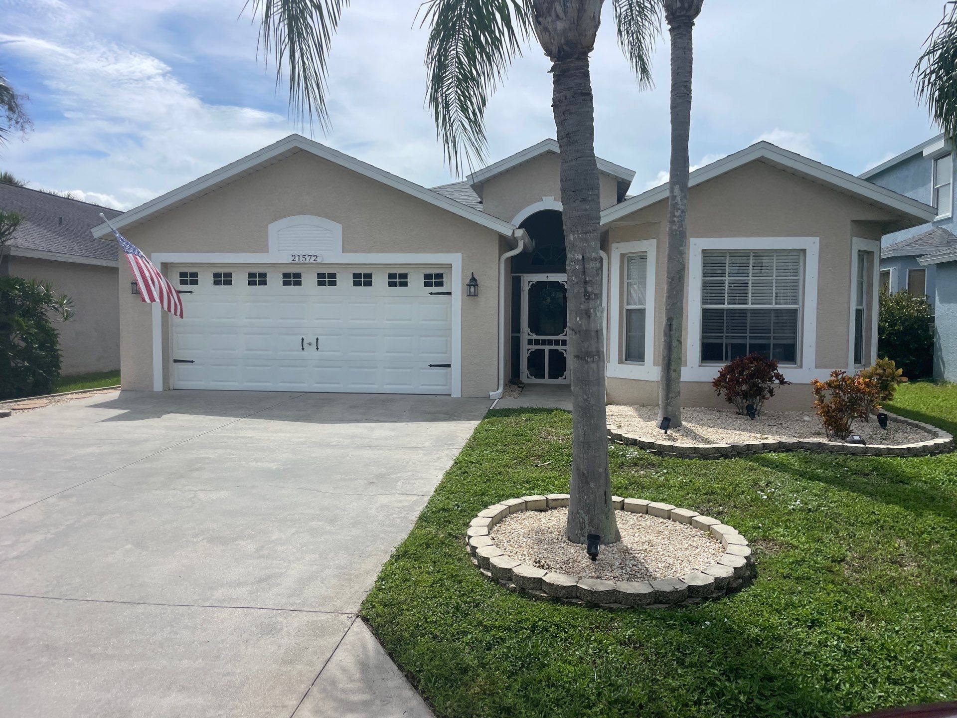 White Aluminum Seamless Gutters and Downspouts in Estero FL by Gutter Professors