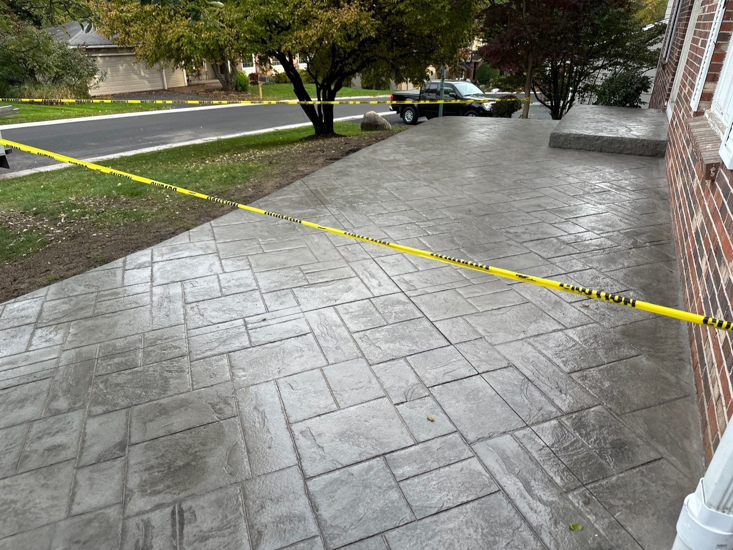 Ashlar slate stamped concrete patio  by NG Masonry & Construction LLC