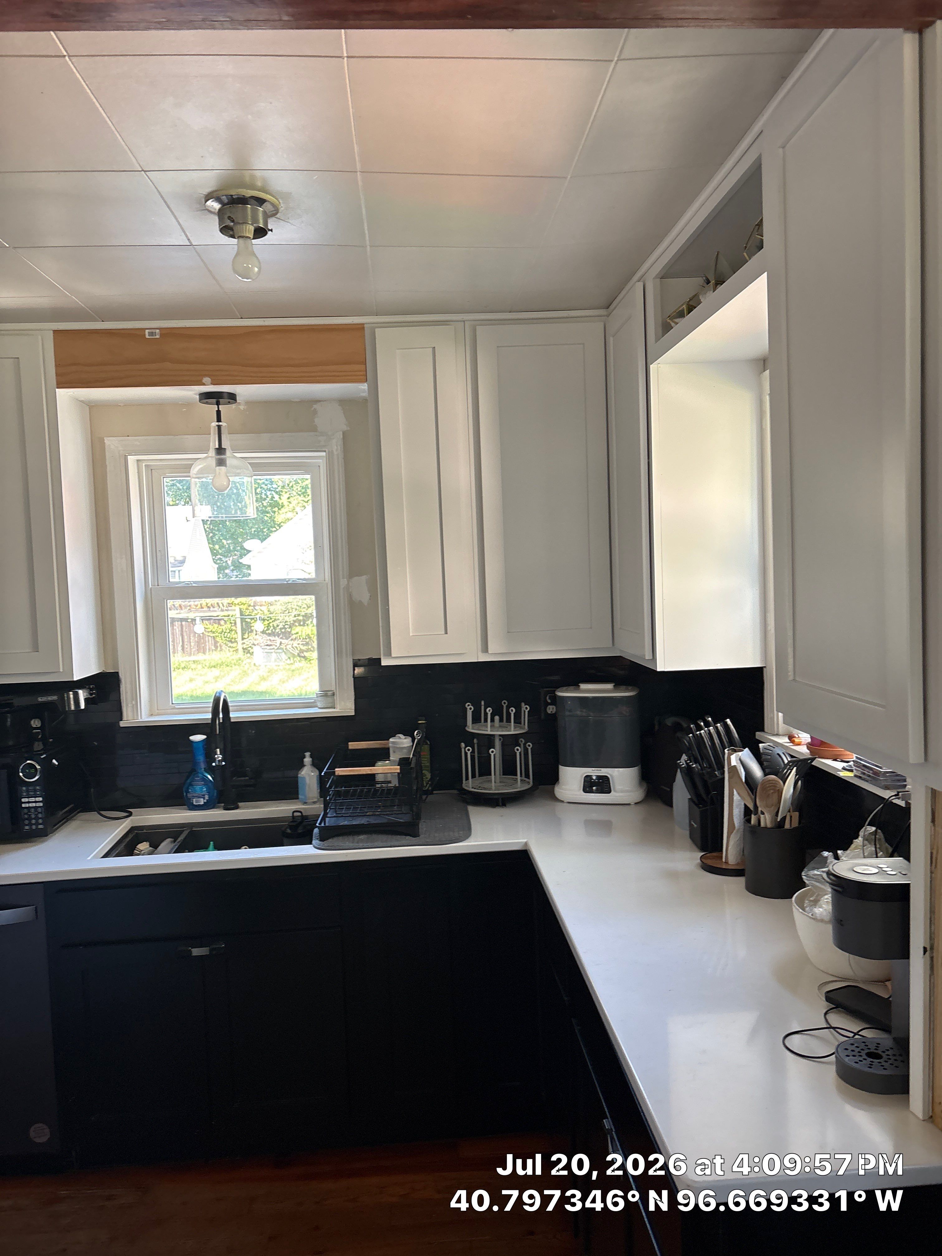 Kitchen Remodel in Lincoln Nebraska Featuring Two-Tone Cabinetry and Black Backsplash by CompanyCam Sales Demo