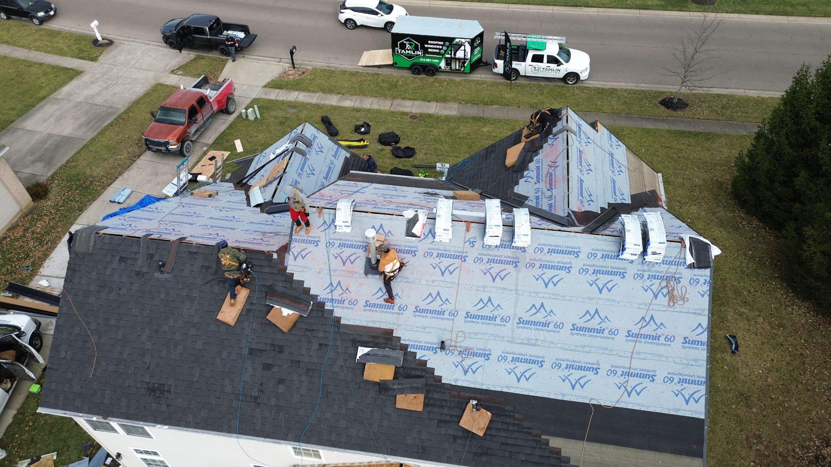 Walden Ponds - Pristine Black and Hydro Flo Gutter Guards by Tamlin Roofing