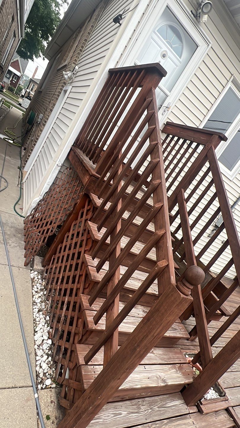 Wood cleaning and staining using Armstrong cloark oil stain by Northern Power Washing LLC.