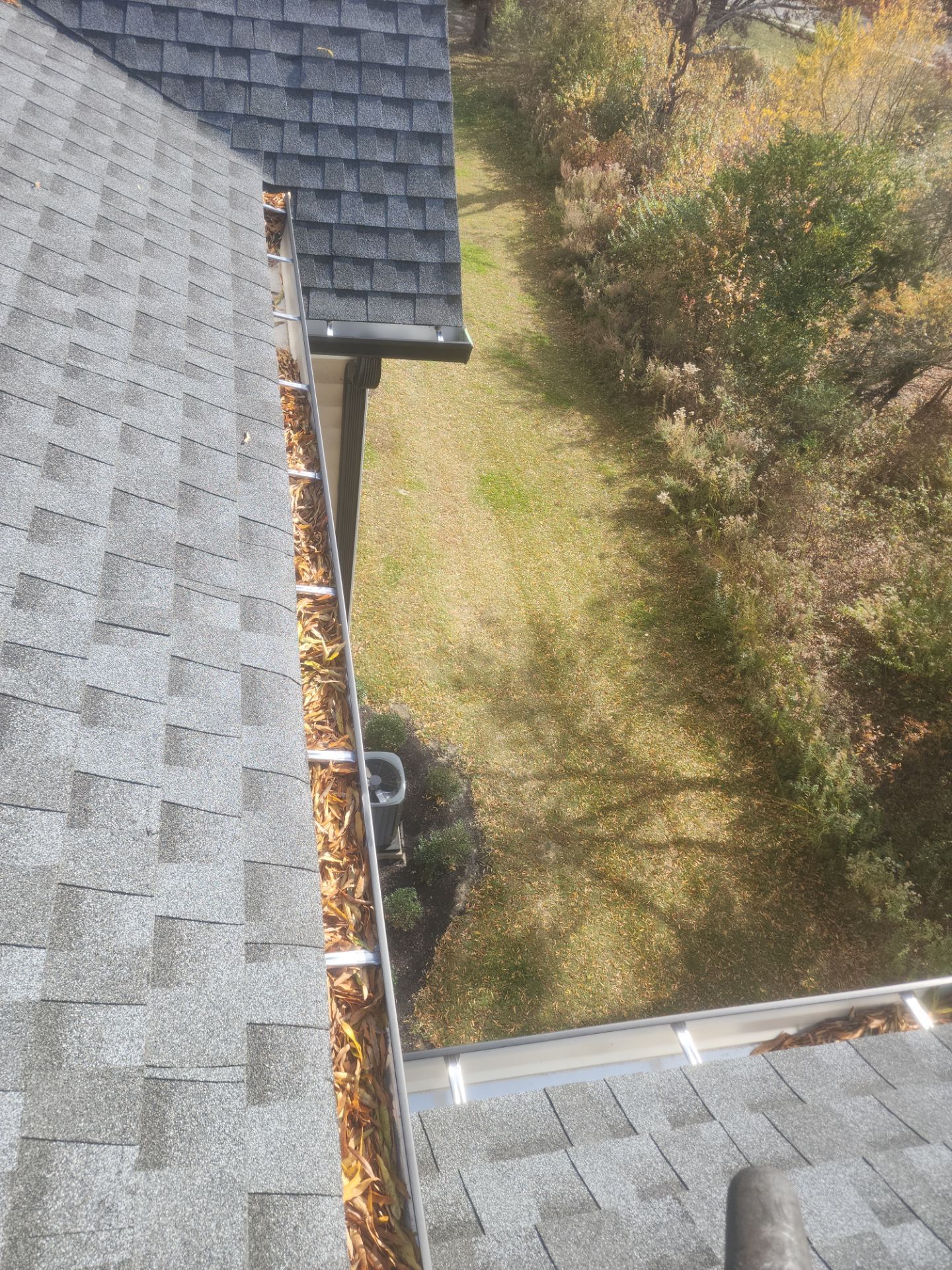 Commercial gutter cleaning New Jersey before photo with filled gutters