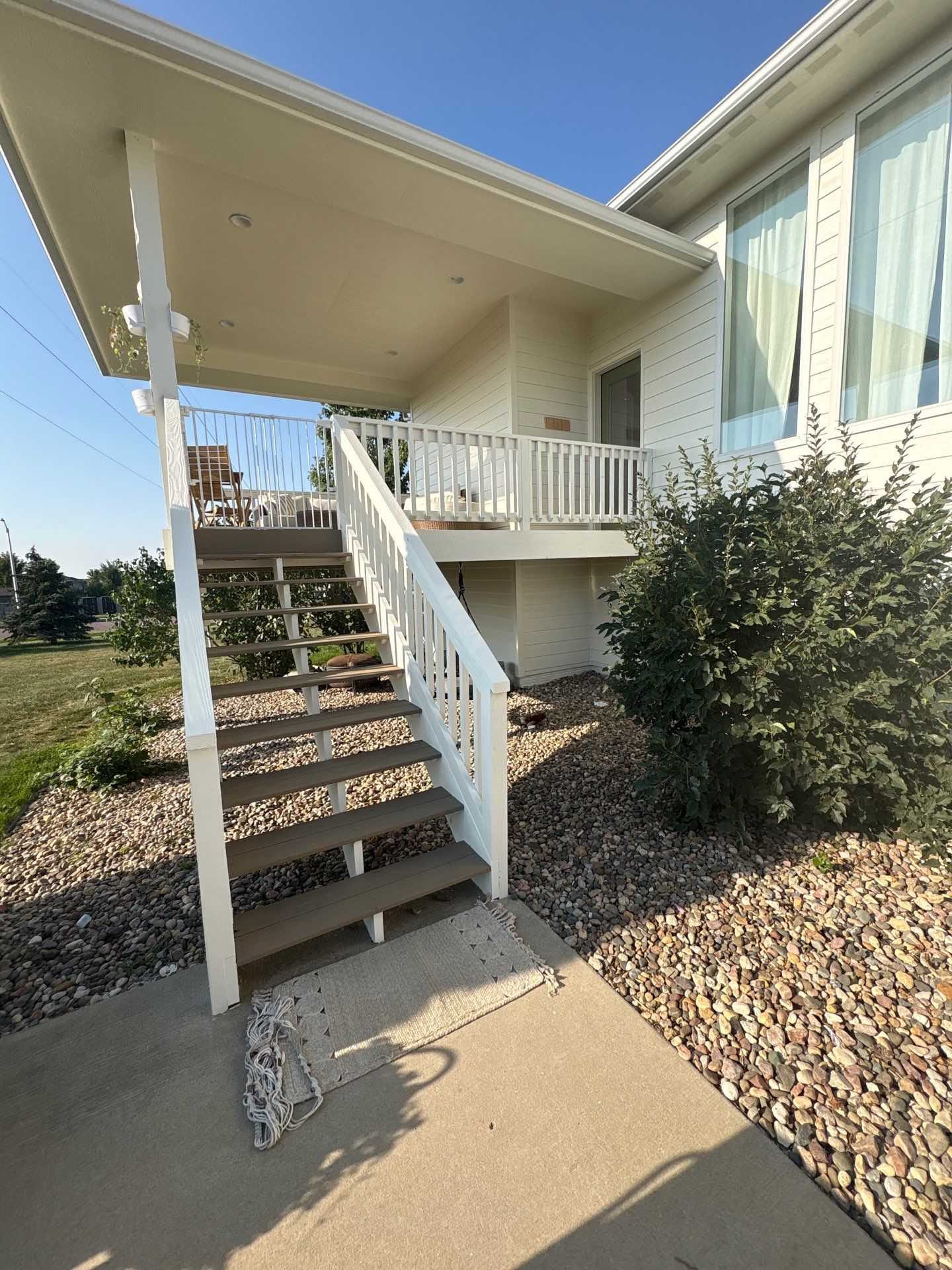 Sioux Falls Exterior Residential Siding and Deck Painting Project by Select Painting, Coatings & Garage Cabinets