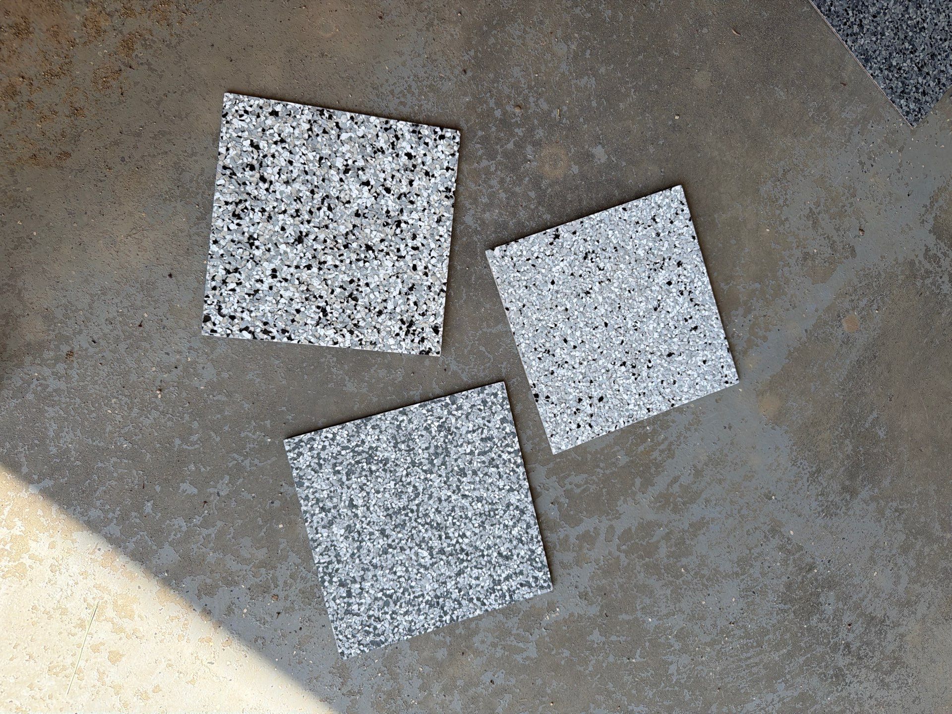Feather Grey Garage Floor Coating Installation in Valley Springs by Select Painting, Coatings & Garage Cabinets
