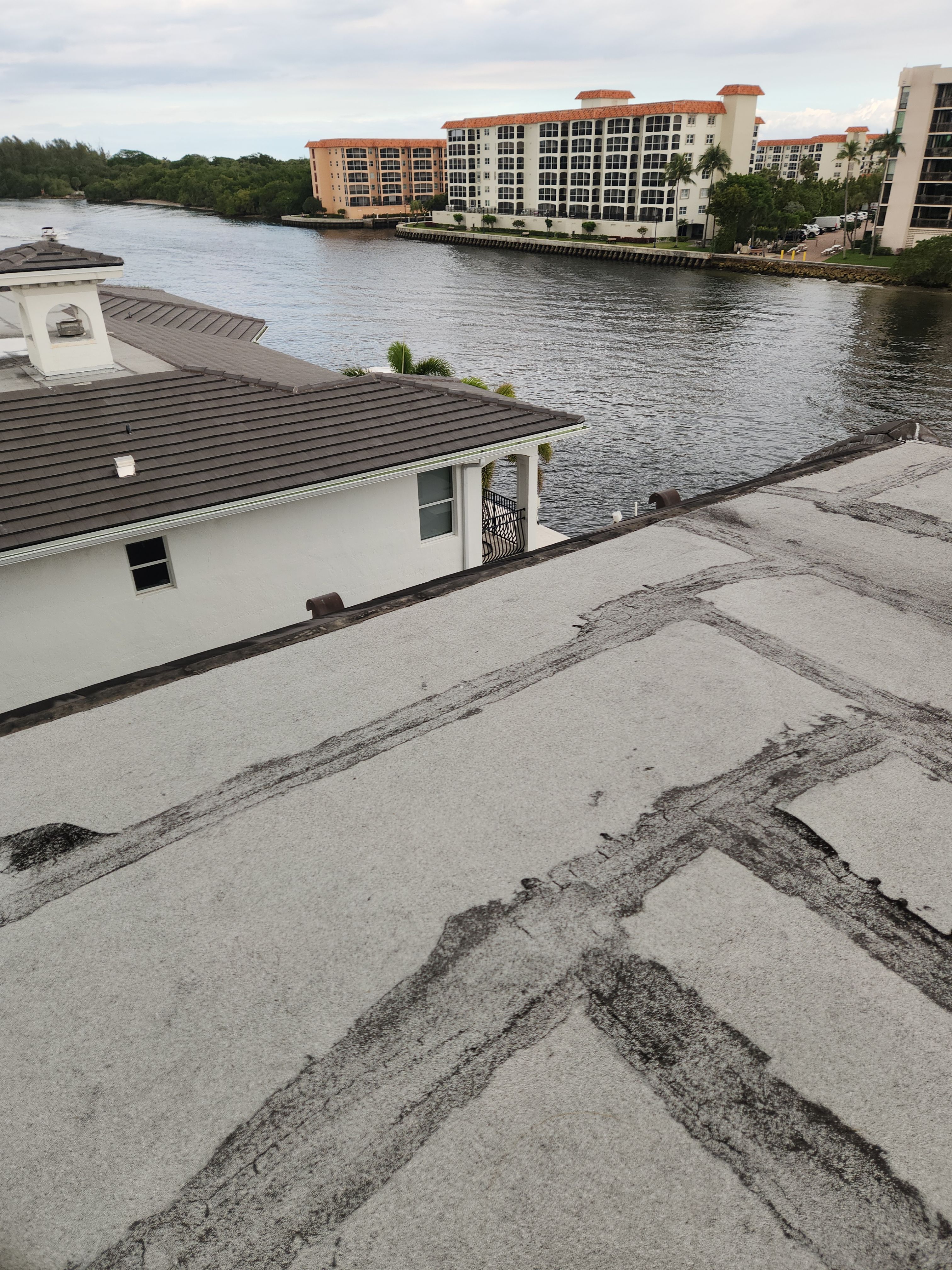 Silicone roof coating and tile tune up in Boca Raton by Aastro Roofing