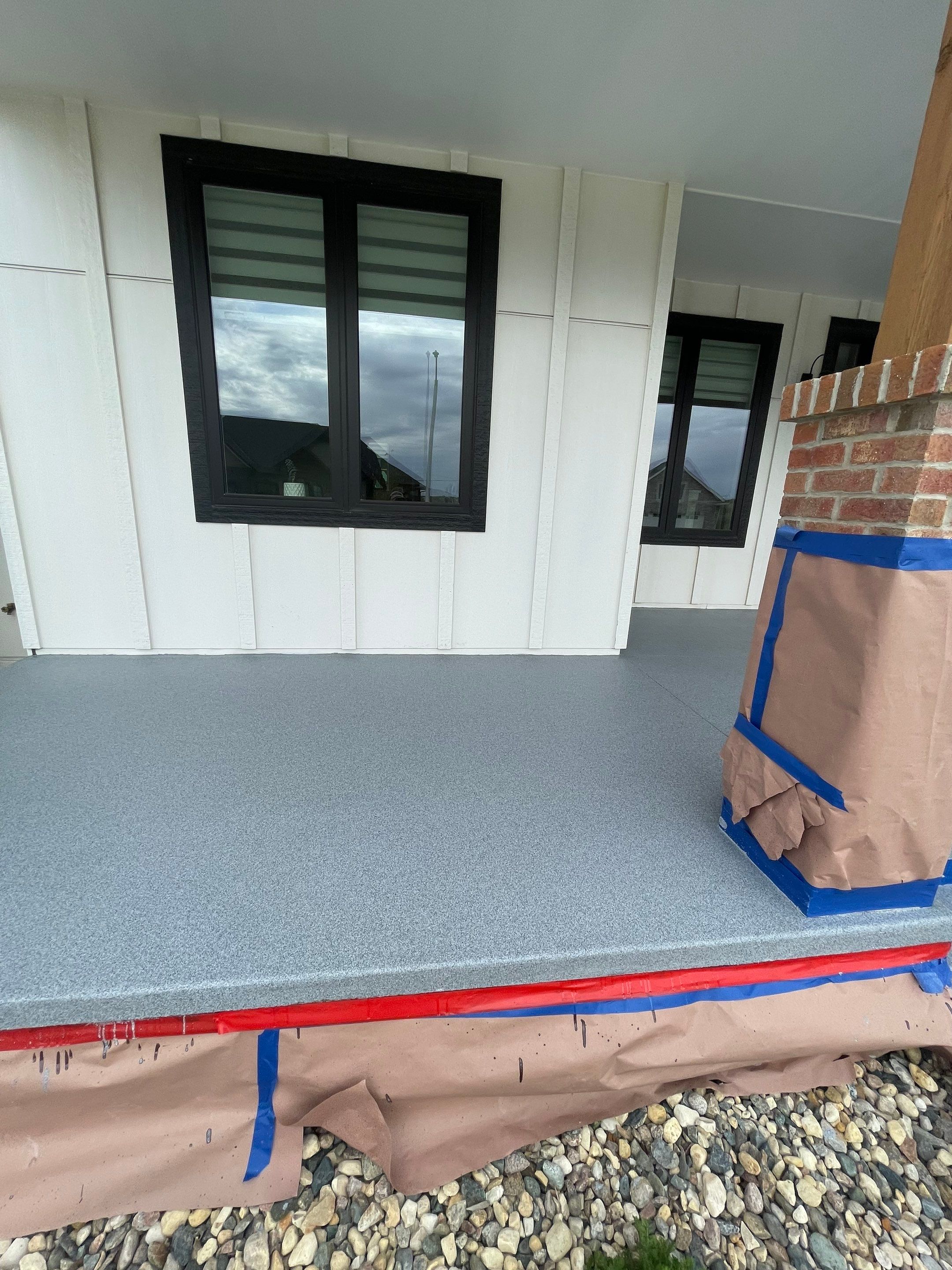 Grey Speckled Concrete Porch Coating for Sioux Falls Home by Select Painting, Coatings & Garage Cabinets