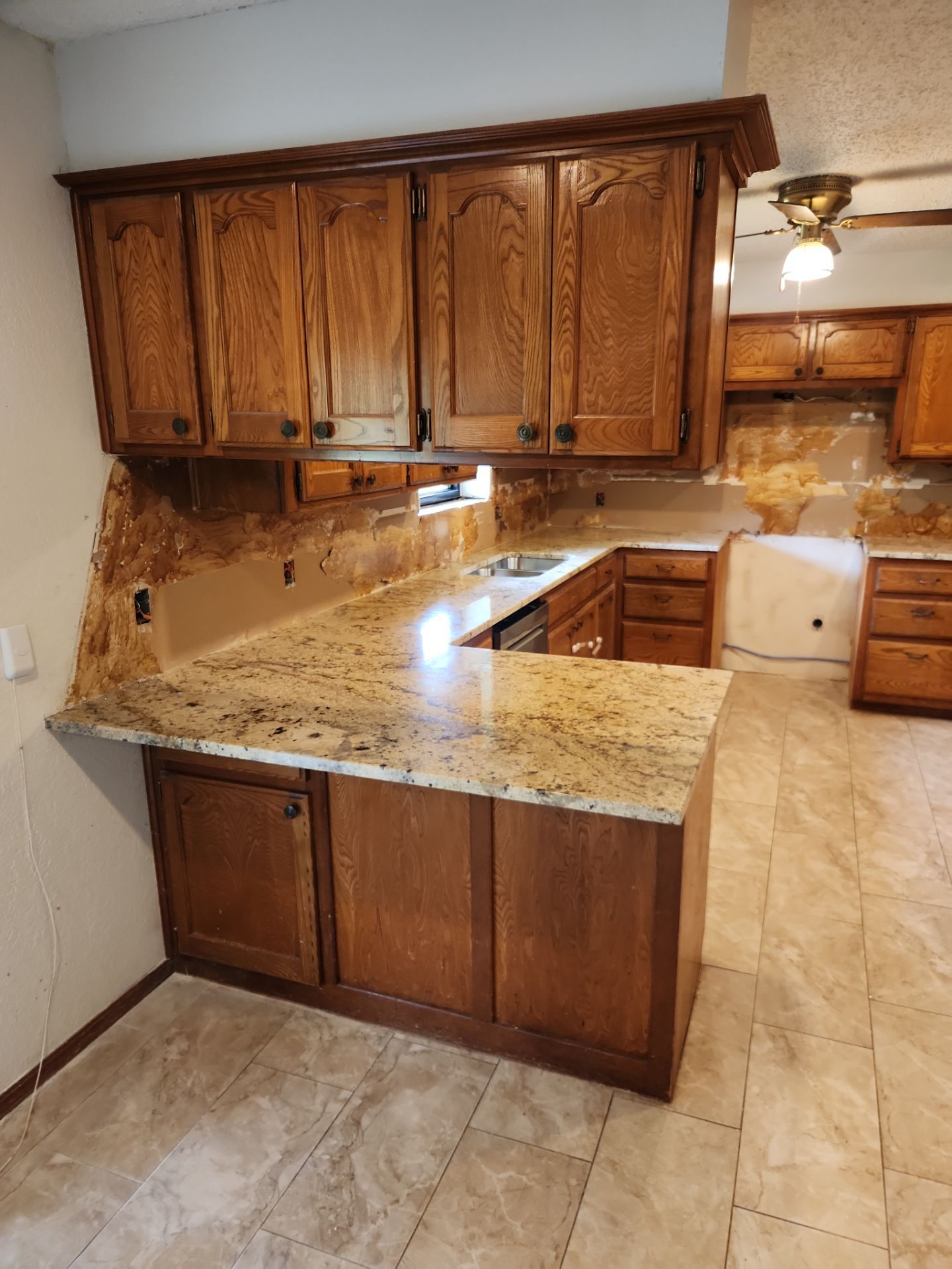 Granite Countertop and Full-Height Backsplash Installation in Washington by TNT Countertops